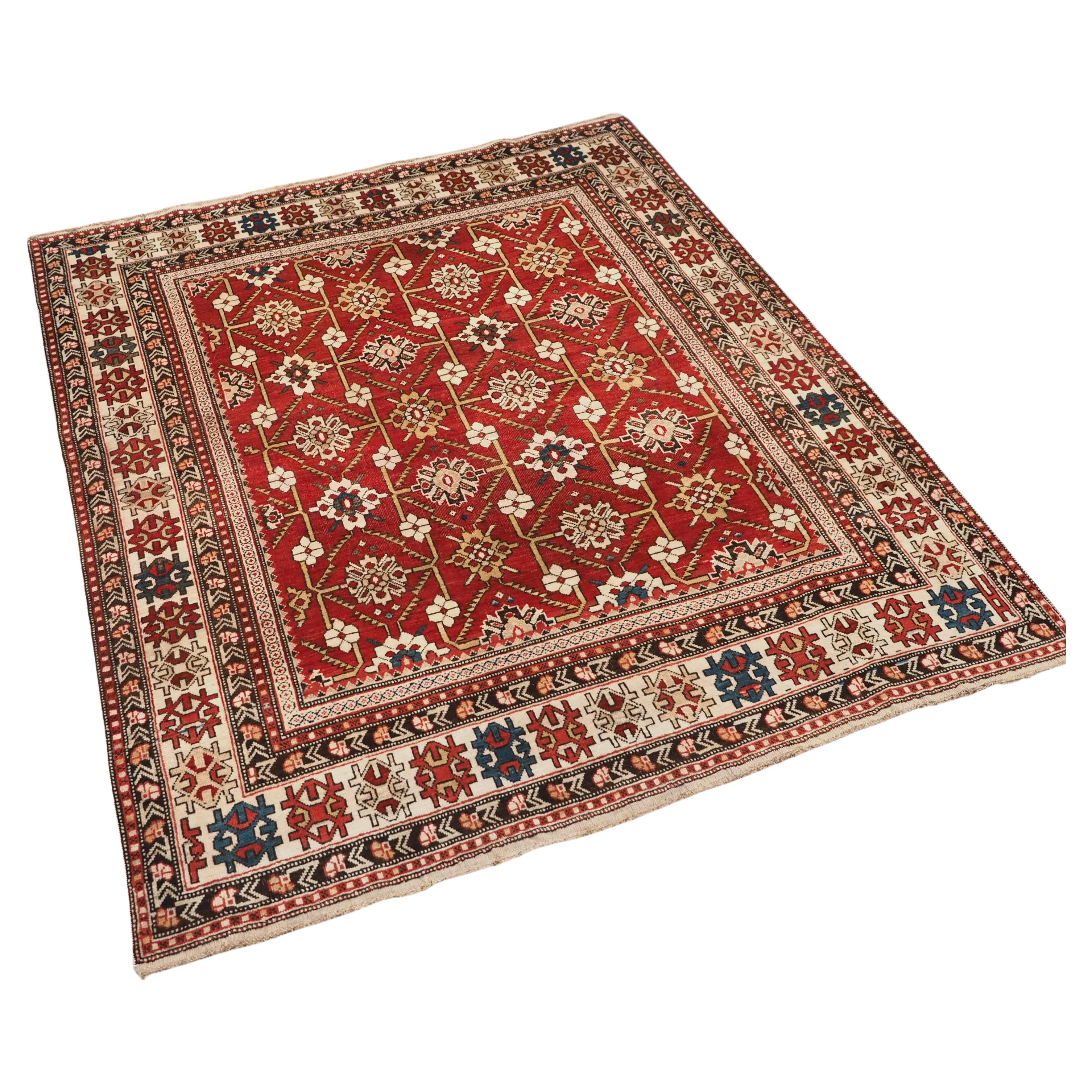 Antique South East Caucasian Shirvan rug with bold floral lattice design. For Sale