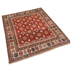 Antique South East Caucasian Shirvan rug with bold floral lattice design.