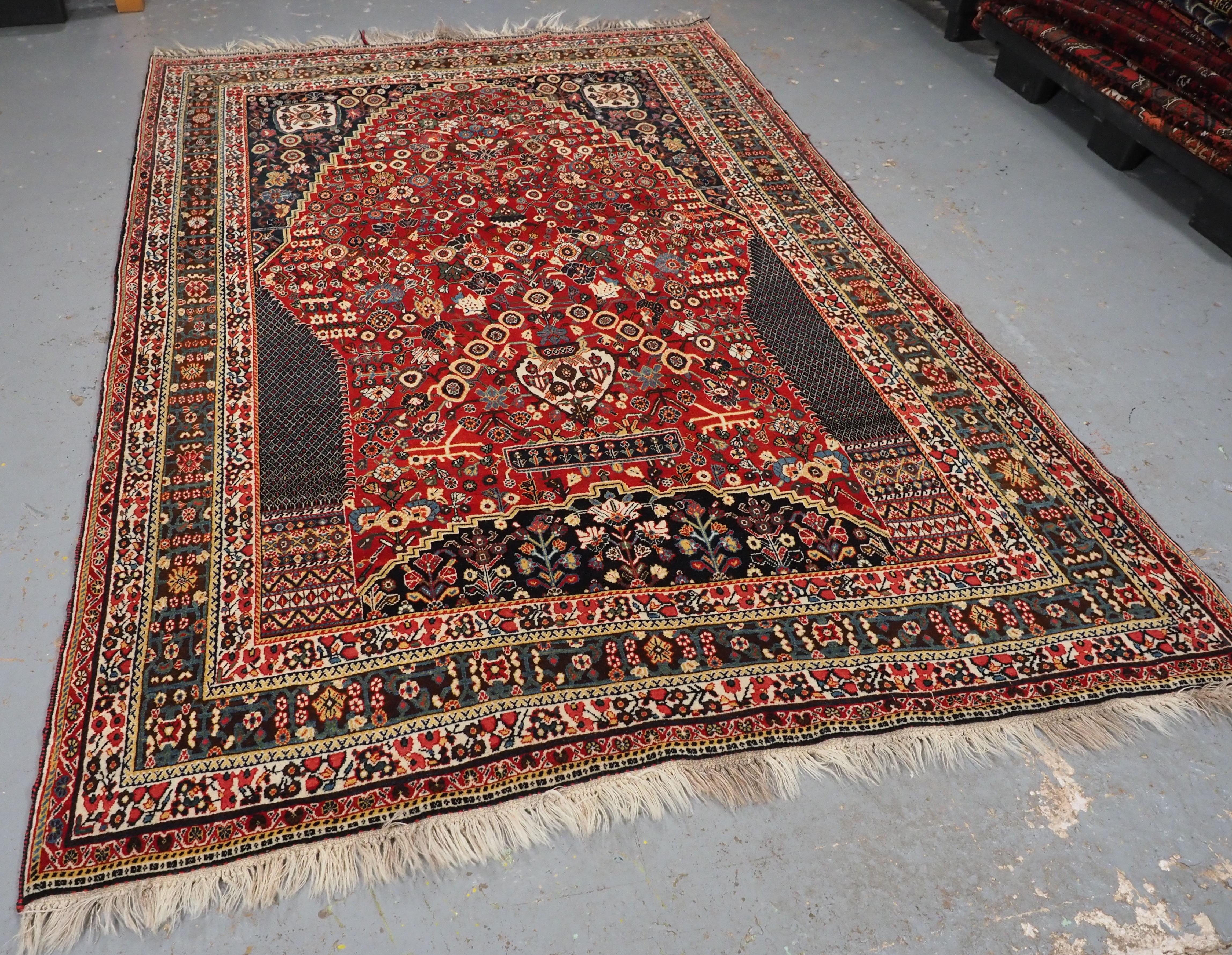 Size: 8ft 6in x 5ft 7in (260 x 170cm).

Antique South West Persian Kashkuli Qashqai rug with millefleur prayer design.

Circa 1900.

A very attractive rug by the Kashkuli sub tribe of the Qashqai. The rug is of the well known and sought after