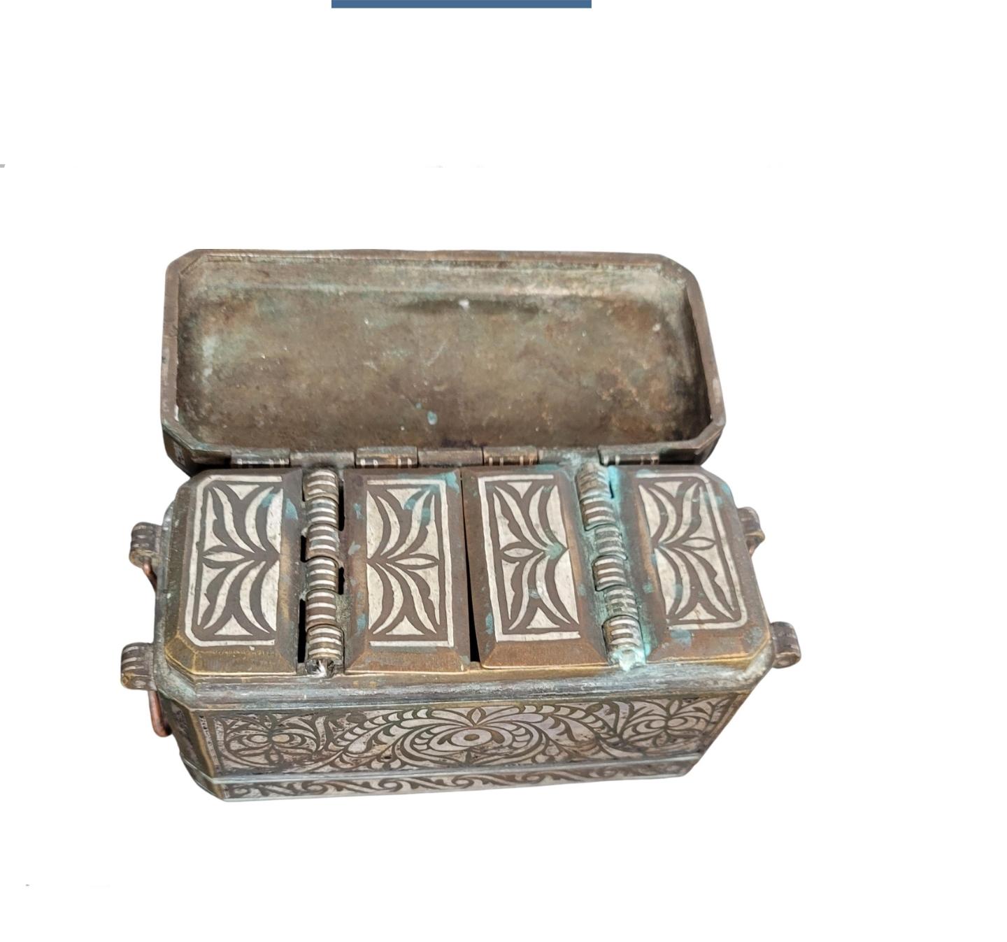 A scarce fine quality antique silver-inlaid solid brass betel nut box (Lutuan), dating to the second half of the 19th / early 20th century, hand-crafted in Mindanao, Philippines.

Boxes such as this were used to store the areca nut (also known as