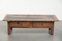 Antique Southern European coffee table made of fruitwood with a drawer