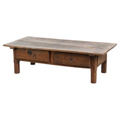 Antique Southern European coffee table made of fruitwood with a drawer