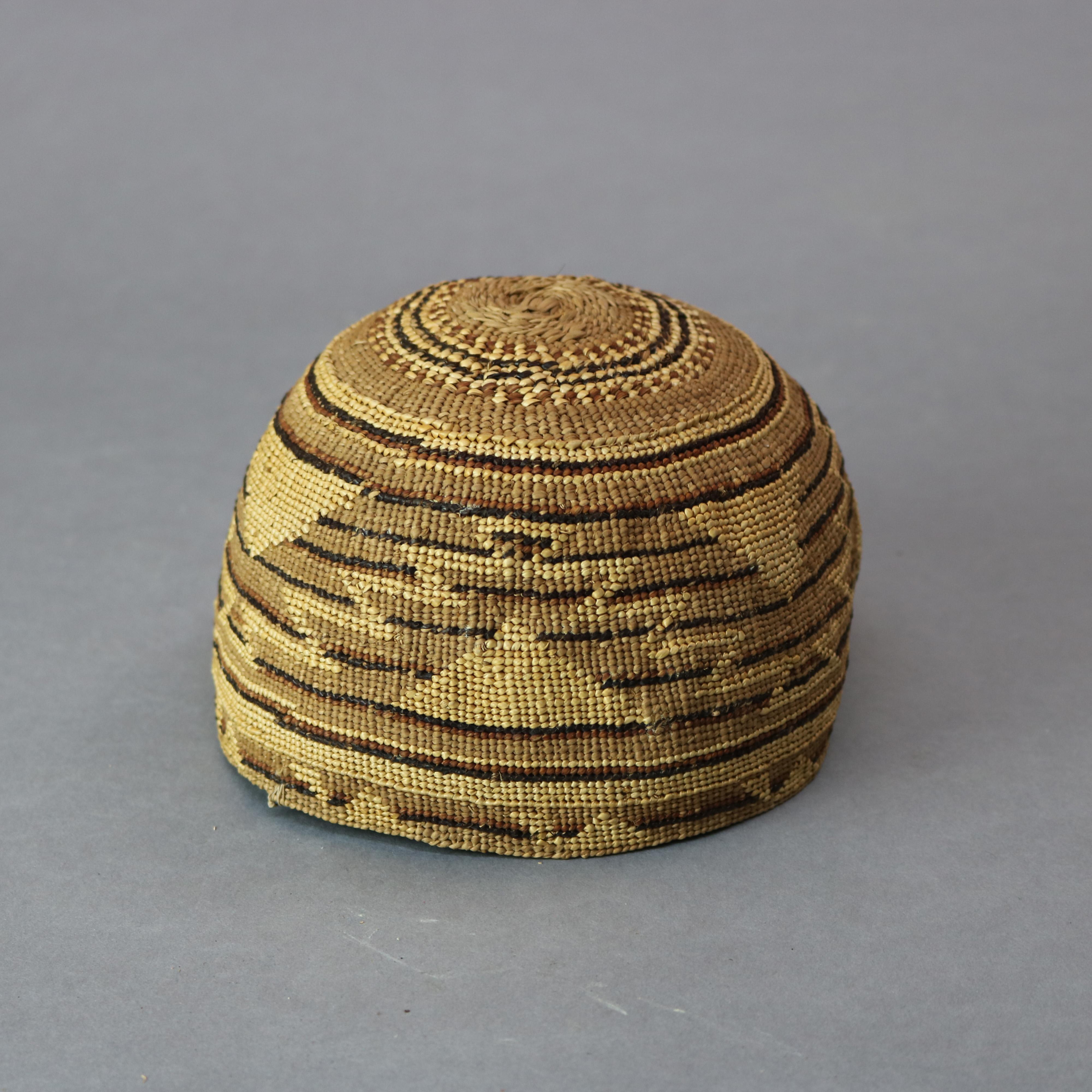 An antique Southwest Native American Indian Pima basket offers handwoven geometric and serrated design, circa 1920

Measures: 4