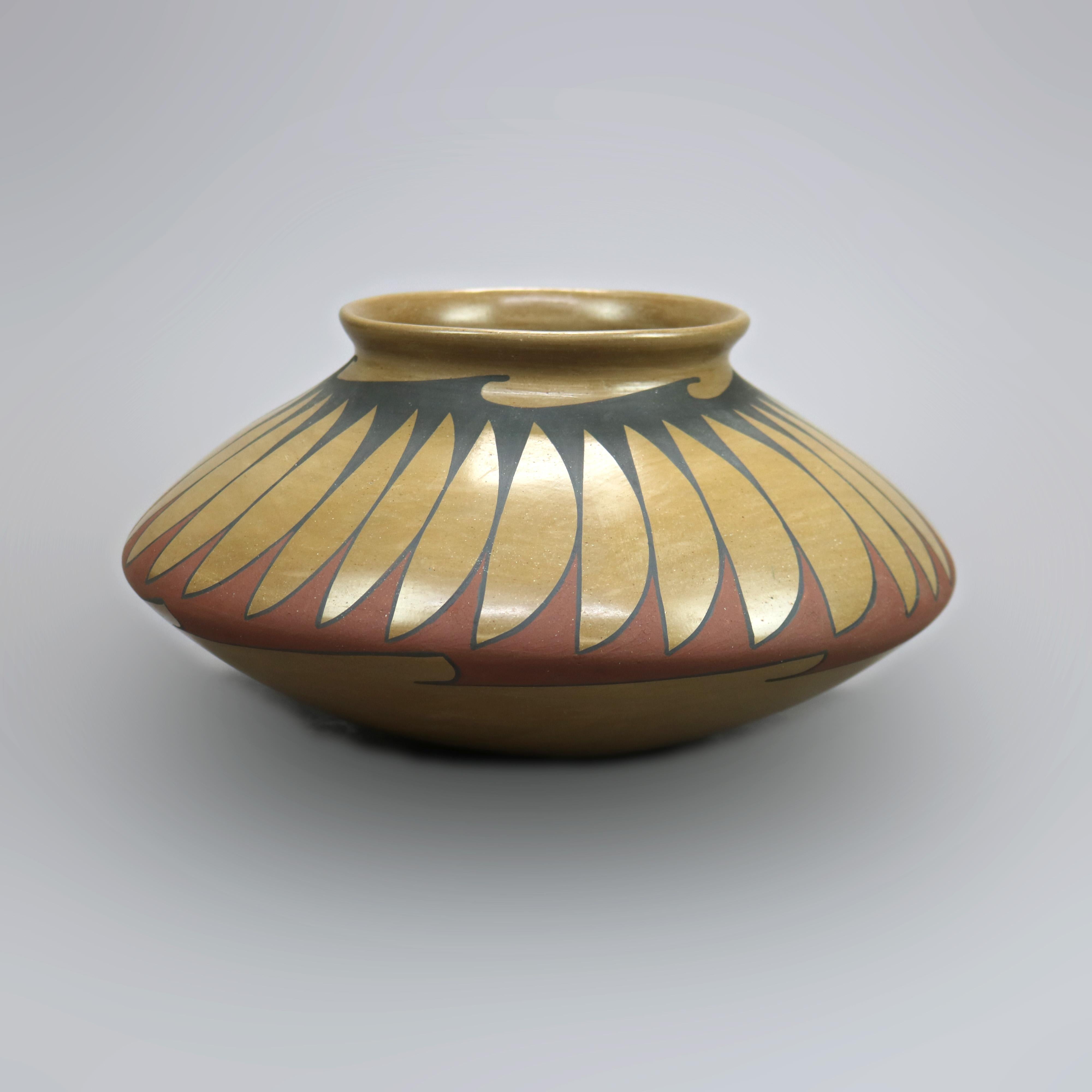 
An antique Mata Ortiz vase by Raphael Silveira, Mexico offers art pottery construction with hand painted stylized leaf and wave bands, artist signed as photographed, reminiscent of Southwestern American Indian Navajo pottery, c1930

Measures-