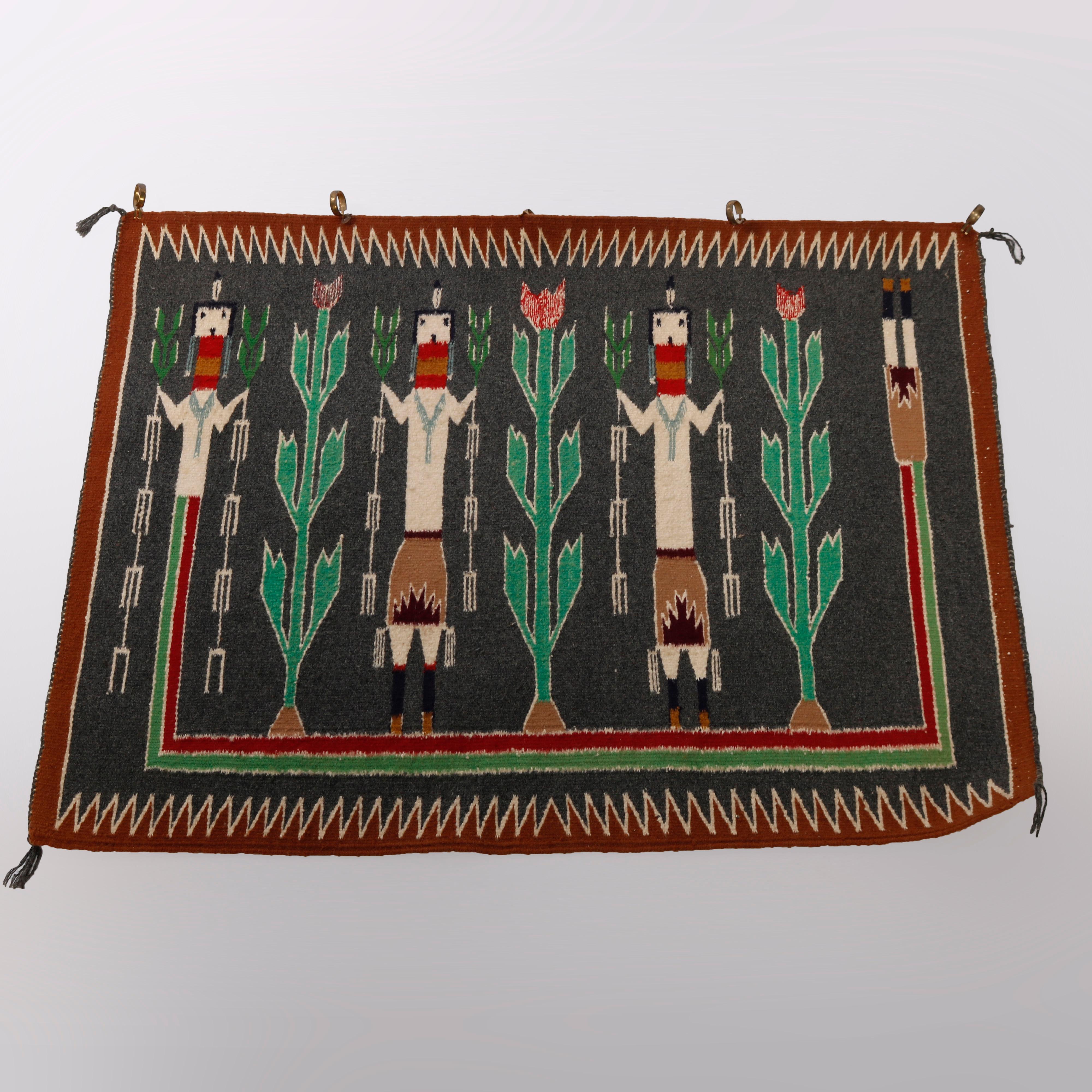An antique Southwestern Native American Indian Navajo Yei rug offers wool construction with three men and crop harvest design, c1930

Measures - 34.75''H x 27.75''W x .5''D.