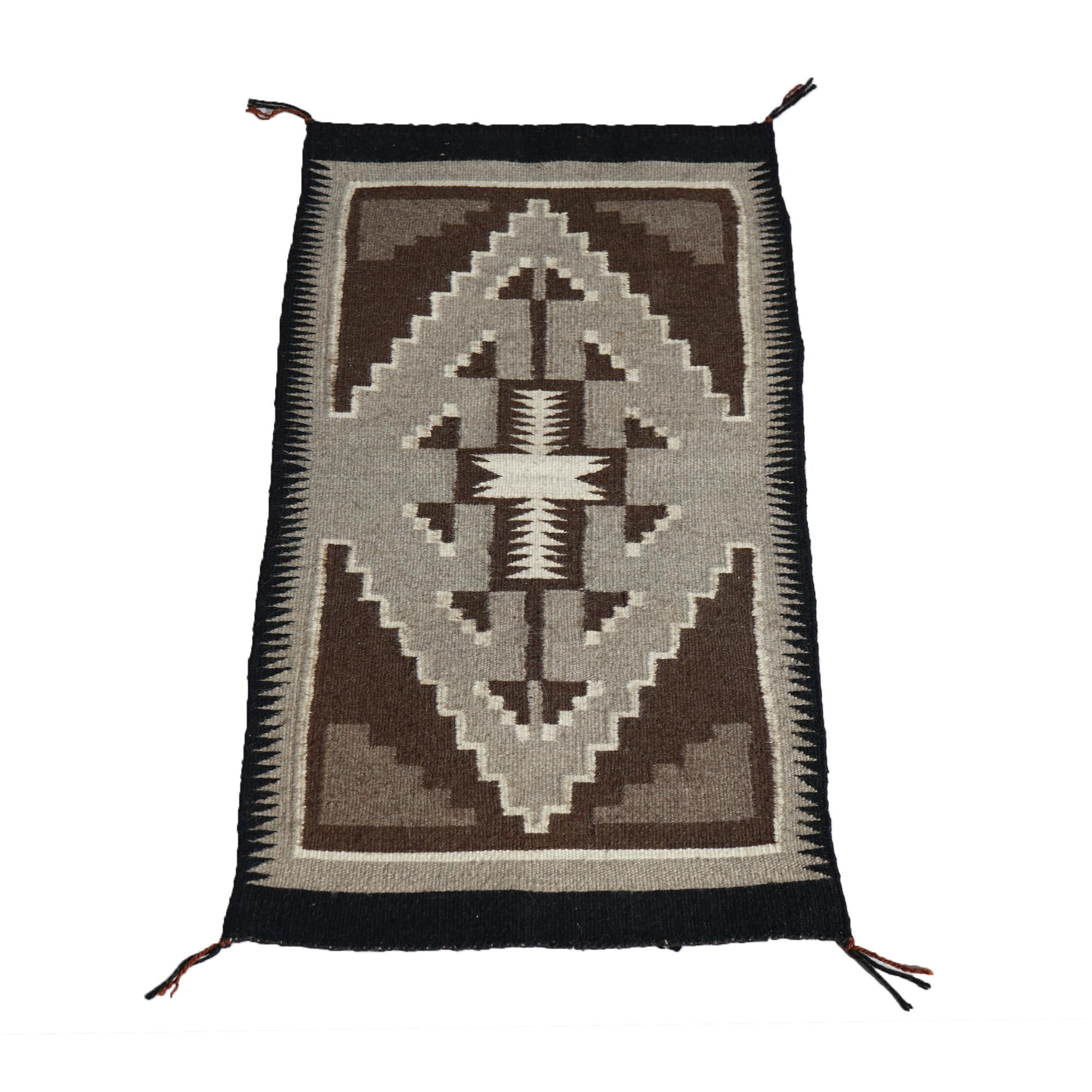 Antique Southwestern Native American Indian Navajo Style Wool Rug with Serrated Central Medallion C1930

Measures- 34.5''H x 17.5''W x .5''D