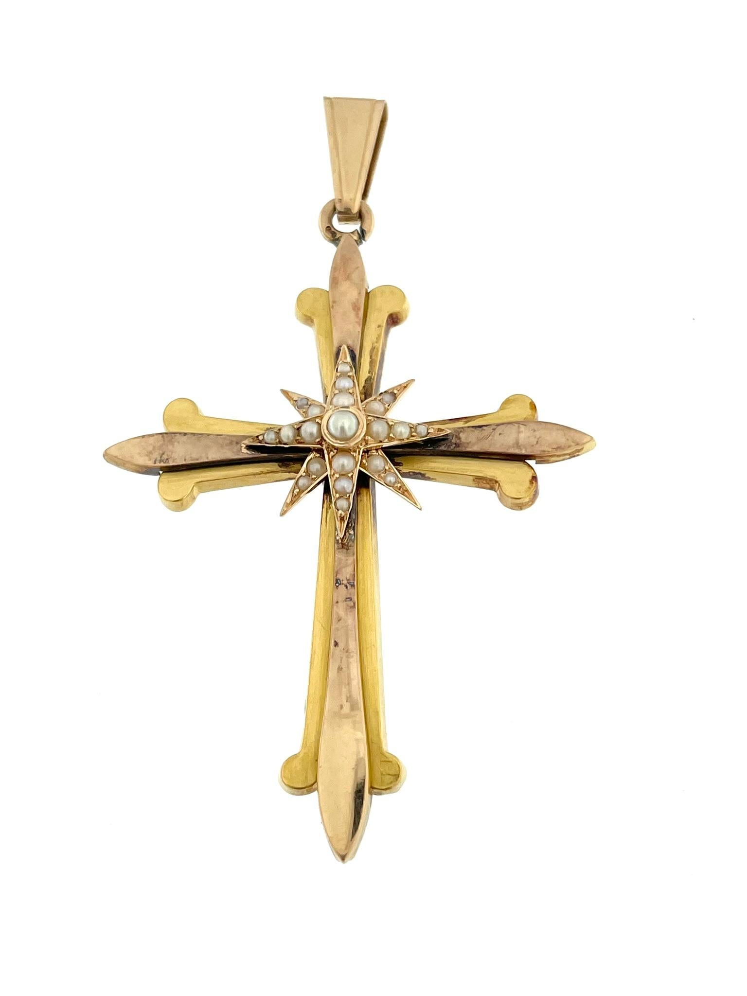The Antique Spanish 18-karat Gold Cross is a captivating piece of jewelry that exudes both history and elegance. Crafted in a combination of yellow and rose gold, the cross features distinctive lily flower endings, adding a touch of grace and