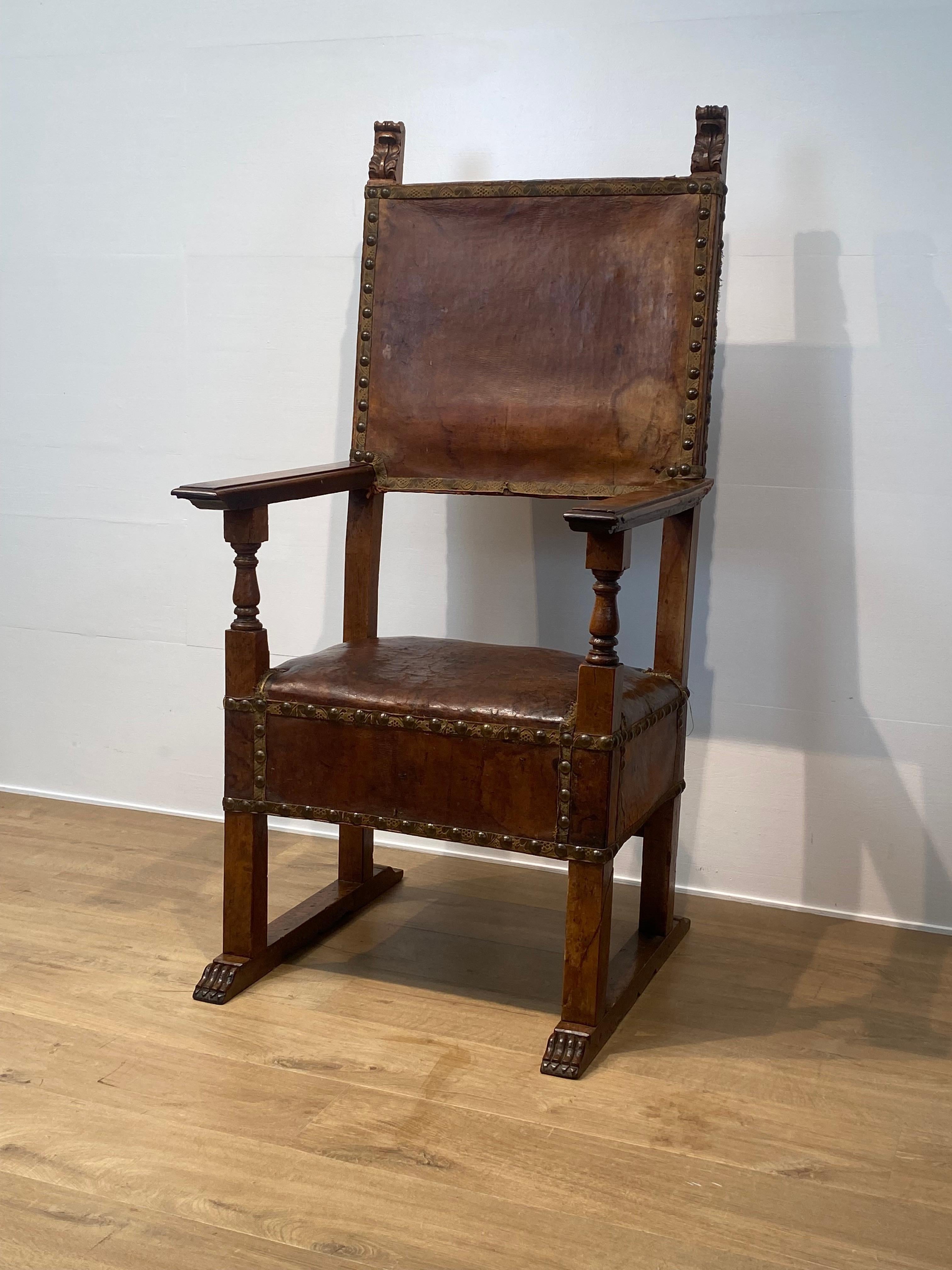 A beautiful,antique Spanish aristocratic Chair with leather seating and back,
beautiful patina and shine of the leather,warmBrown Color,
charming wear of the leather due to age,
the chair is finished with the typical Iron nails,
comfortable