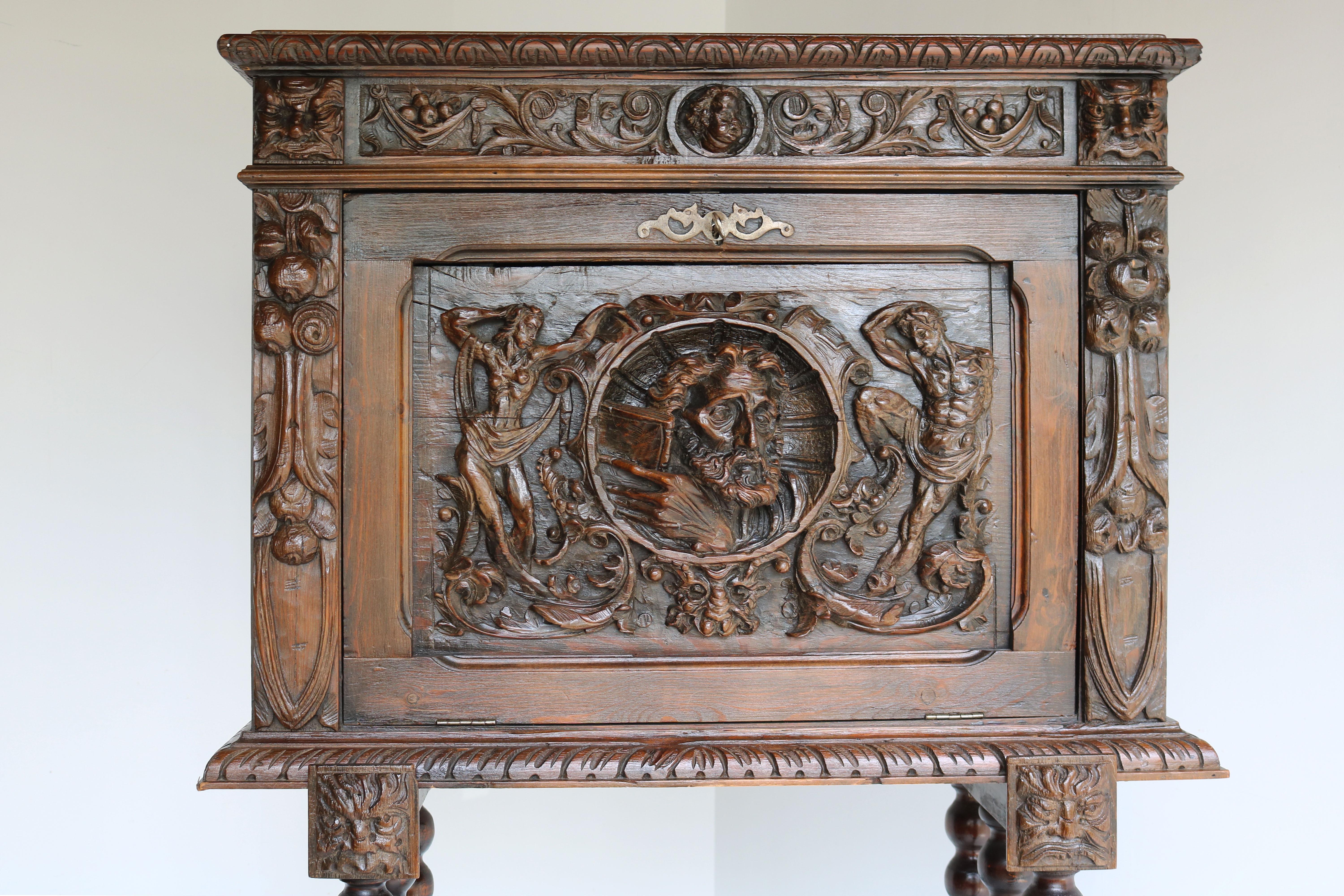 Exquisite Spanish Bargueño cabinet from late 19th century Renaissance style , Richly carved with wrought iron grips on the side & bobbin legs. 
Amazing details & craftsmanship in a most impressive design style. The cabinet is filled with details