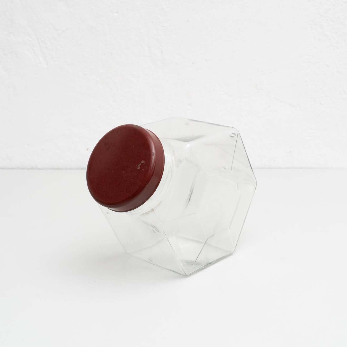 Antique Spanish glass container with a plastic cap. 

Made by unknown manufacturer in Spain, circa 1950.

In original condition, with minor wear consistent with age and use, preserving a beautiful patina.

Materials:
Glass
Plastic.

