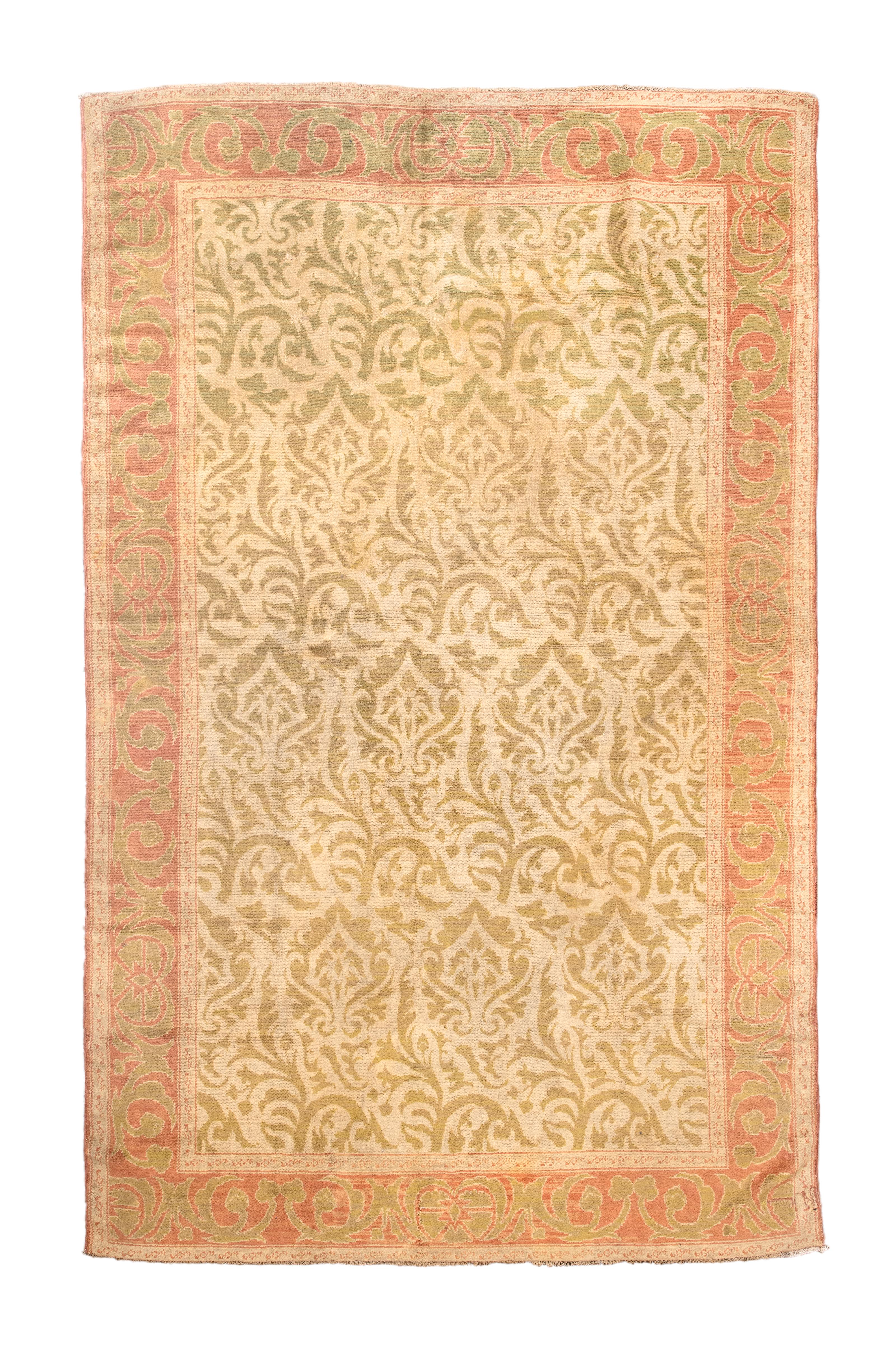 The saturated straw yellow field holds an offset velvet pattern of Renaissance palmettes and flowing leafy stems. Rust border with fleshy voluted arabesques. A rare and attractive piece with a unidirectional design. 

Rug Size
6' 8