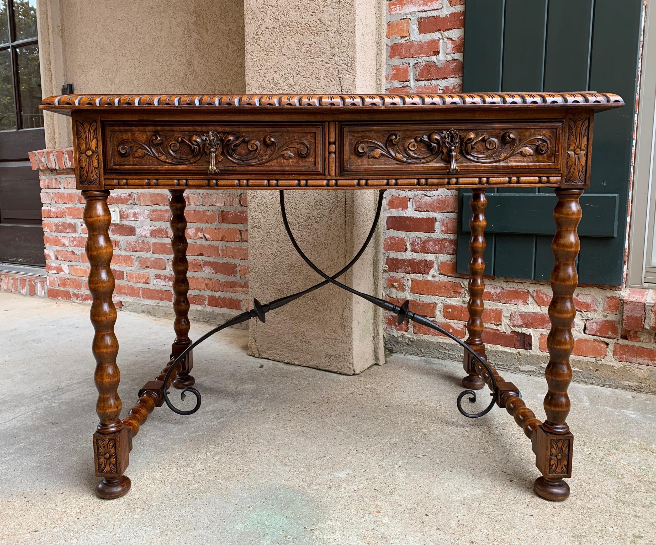 Antique Spanish carved oak office desk writing sofa side table catalan iron

~Direct from Europe~
~Lovely antique writing table/desk with a stunning silhouette. 

~Beveled edge top over a frieze that features two large drawers with carved