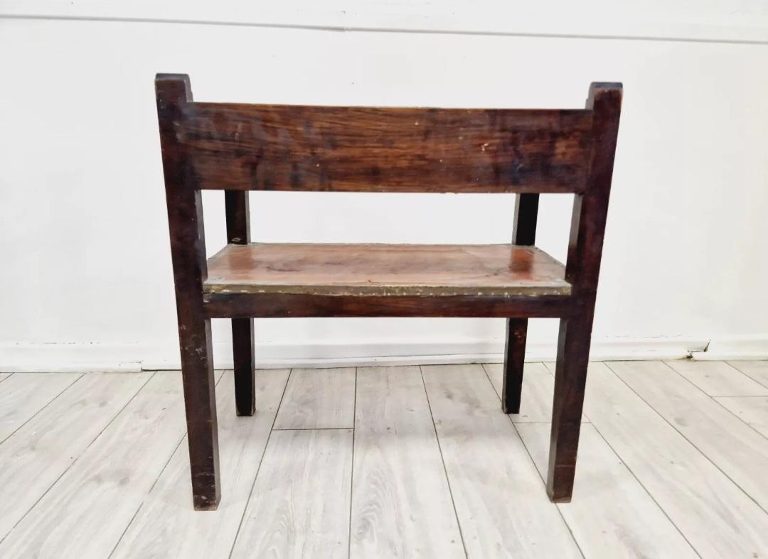 Add a touch of colonial charm to your home with this beautiful antique Spanish chair. Crafted from wood, brass and leather, this fully assembled armchair measures 70cm in length, 37cm in width and 75cm in height. The chair features intricate