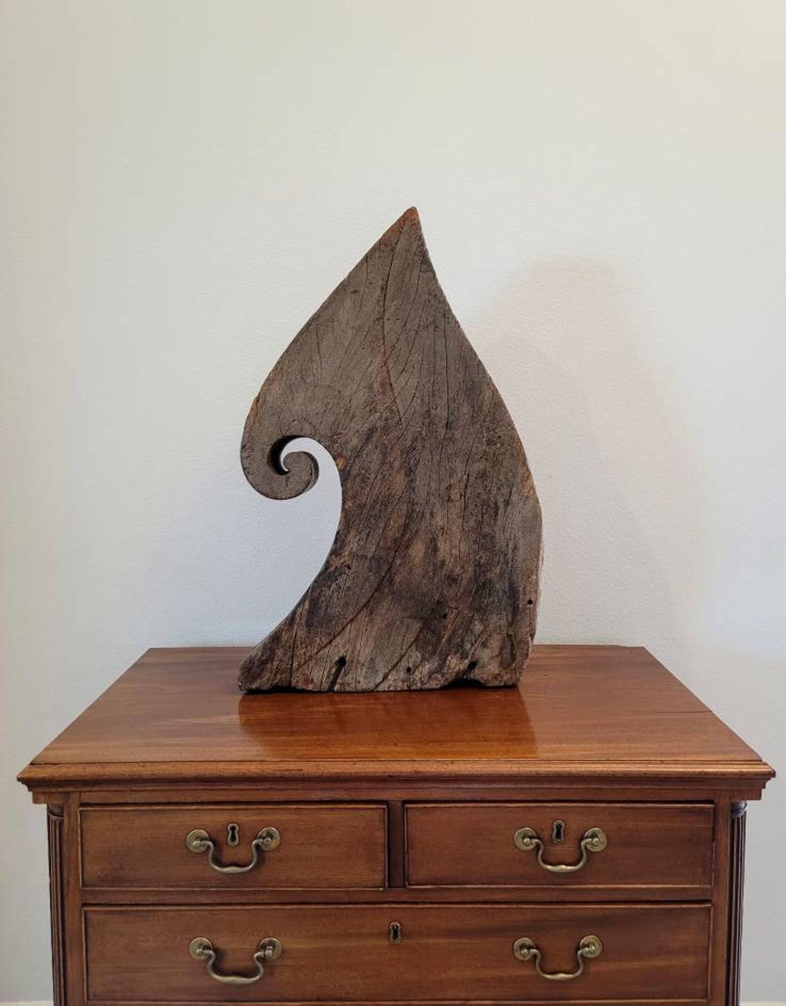 Scarce Spanish Colonial era wooden boat prow. circa 1800

Born around the late 18th / early 19th century, this large sculptural hand-carved architectural salvaged ornamental ship element features a distinctive wave shape with curling volute,