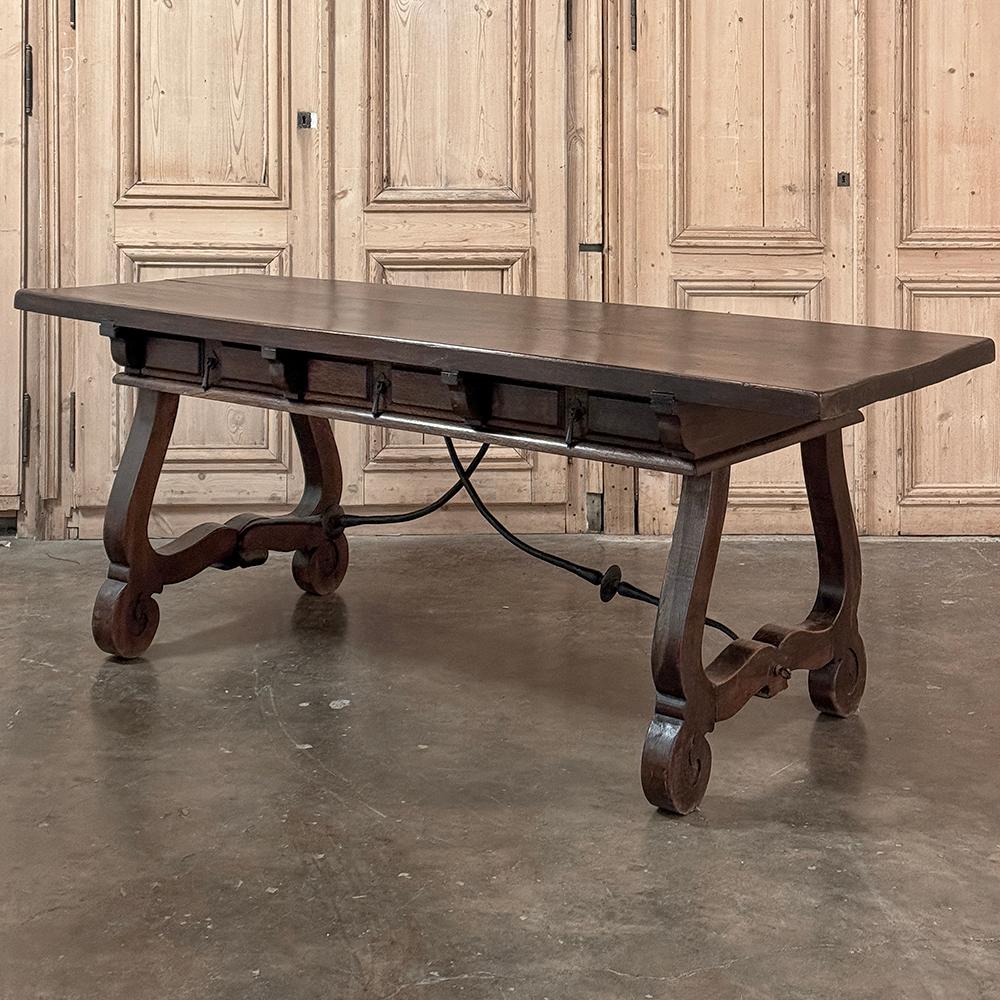 Antique Spanish Colonial Desk honors the traditional craftsmanship of the Iberian peninsula, with a design that dates back centuries!  Using solid planks of selected hardwoods, the thick, durable writing surface was placed atop a shallow casework