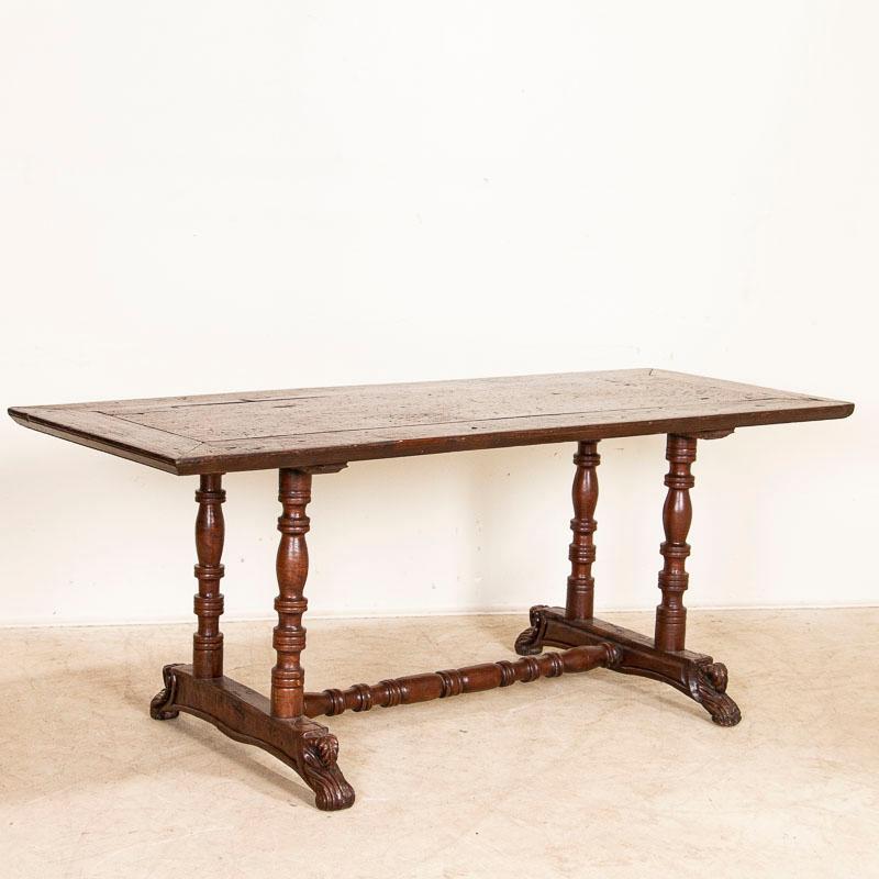 Blending Spanish colonial craftsmanship and design, this 6' table is made from the beautiful and hard narra wood from the Philippines. The table has a light open feel with the attractive turned legs and trestle base, accented with the