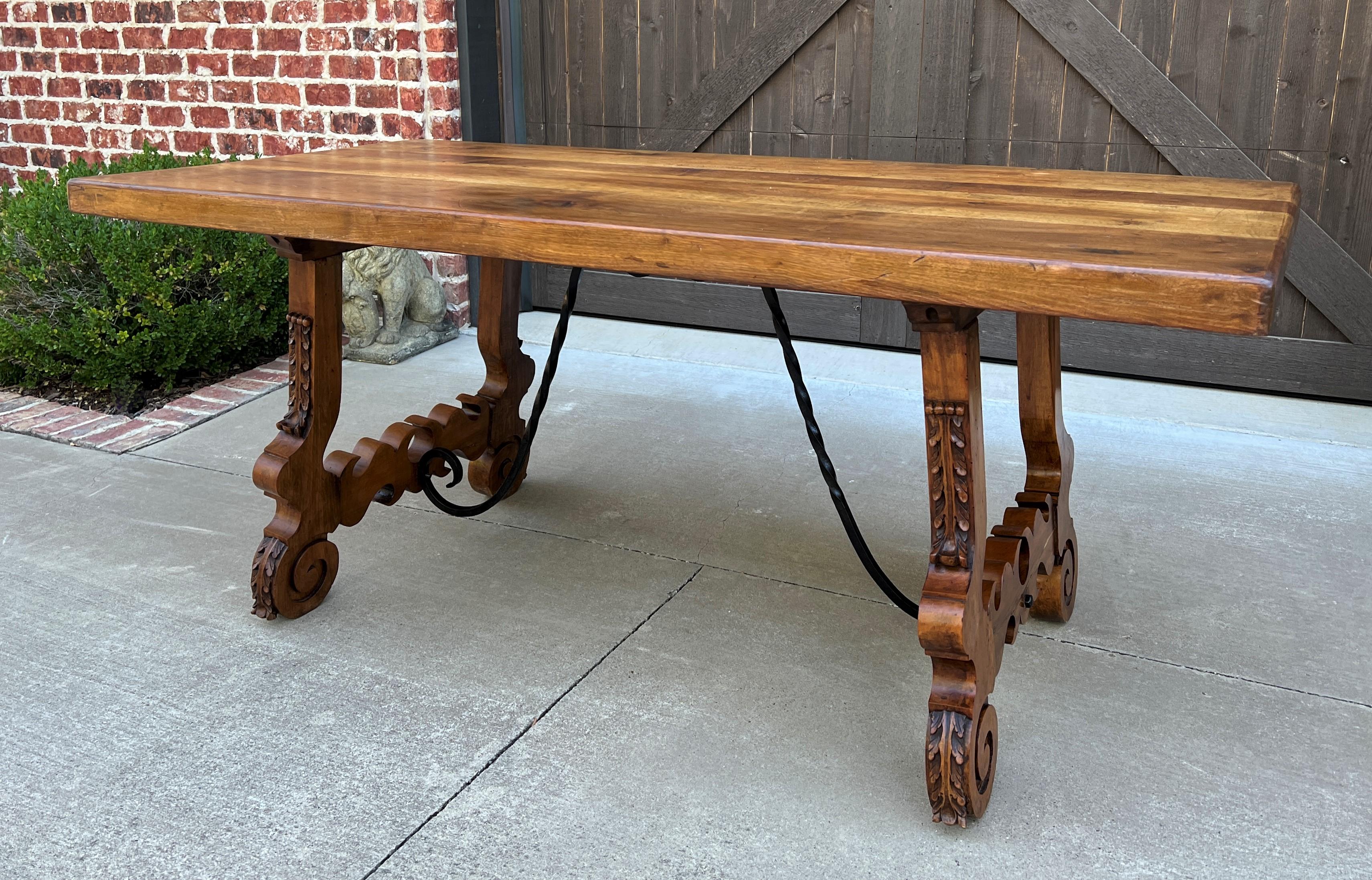 Antique Spanish colonial walnut catalan style dining table, desk, Library or conference table~~Iron Stretcher with Shaped/Carved Legs~~c. 1920s.
 
 