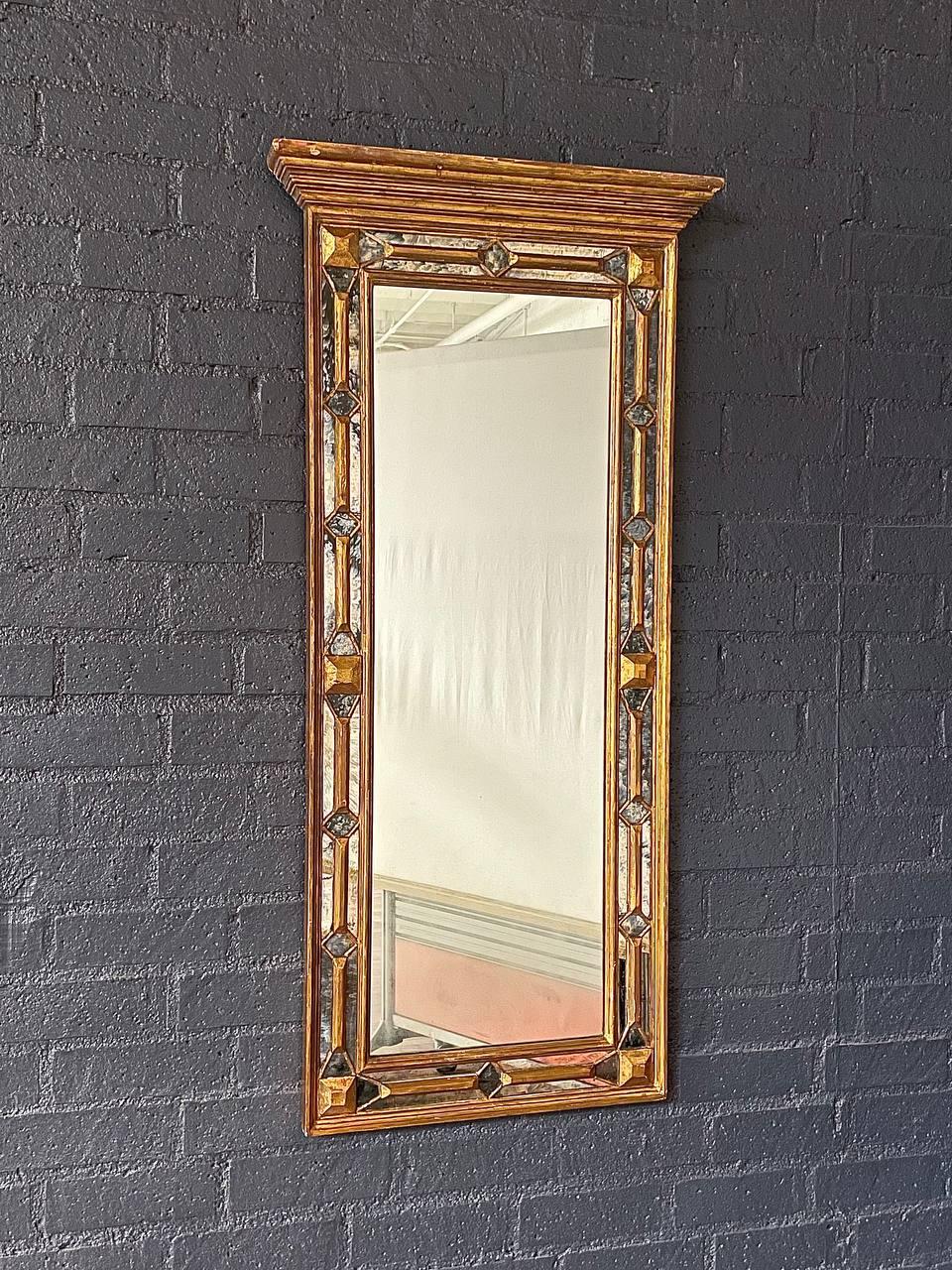 Condition: Original Vintage Condition

Materials: Gilded Wood, Original Glass Mirror

Elevate your space with this Antique Spanish Colonial Gilded Mirror, a stunning reflection of Old World craftsmanship. Its hand-carved wooden frame, adorned with