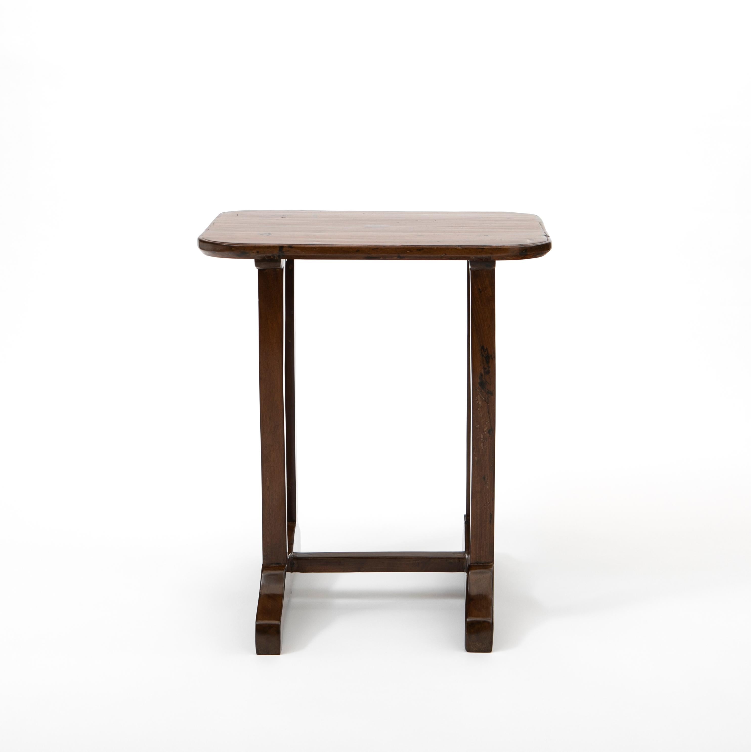 Elegant 19th century solid Narra wood side table from the Philippines.
Rectangular table top with rounded corners made from one solid piece of narra wood.
The Philippines were a Spanish colony for over 300 years, so this is a wonderful example of