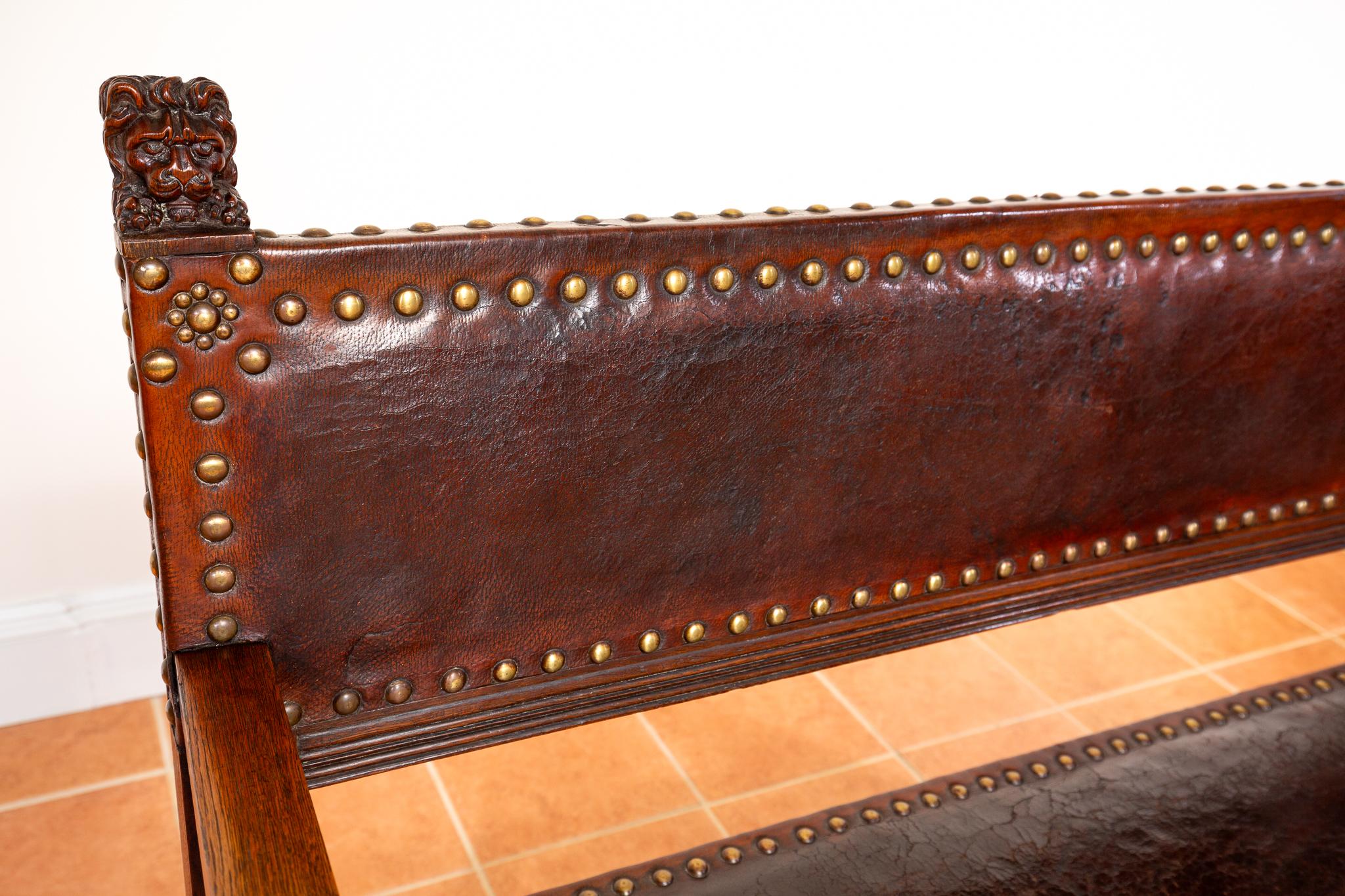 An extremely impressive, strikingly attractive and very rare Spanish oak and studded leather bench in good antique condition. Most likely made around 1890 in Spain in the Spanish Colonial style, this gorgeous bench is packed with quality and exudes