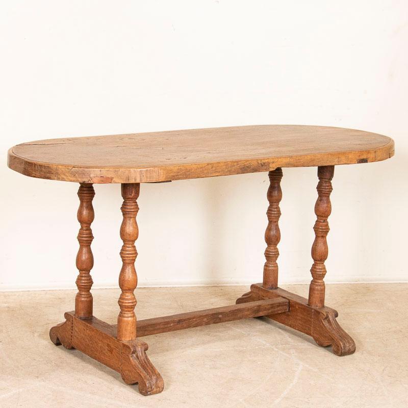 There is tremendous visual appeal in this oval side table thanks to its rich history. The table is made from beautiful hardwood from the Philippines, and has an almost 