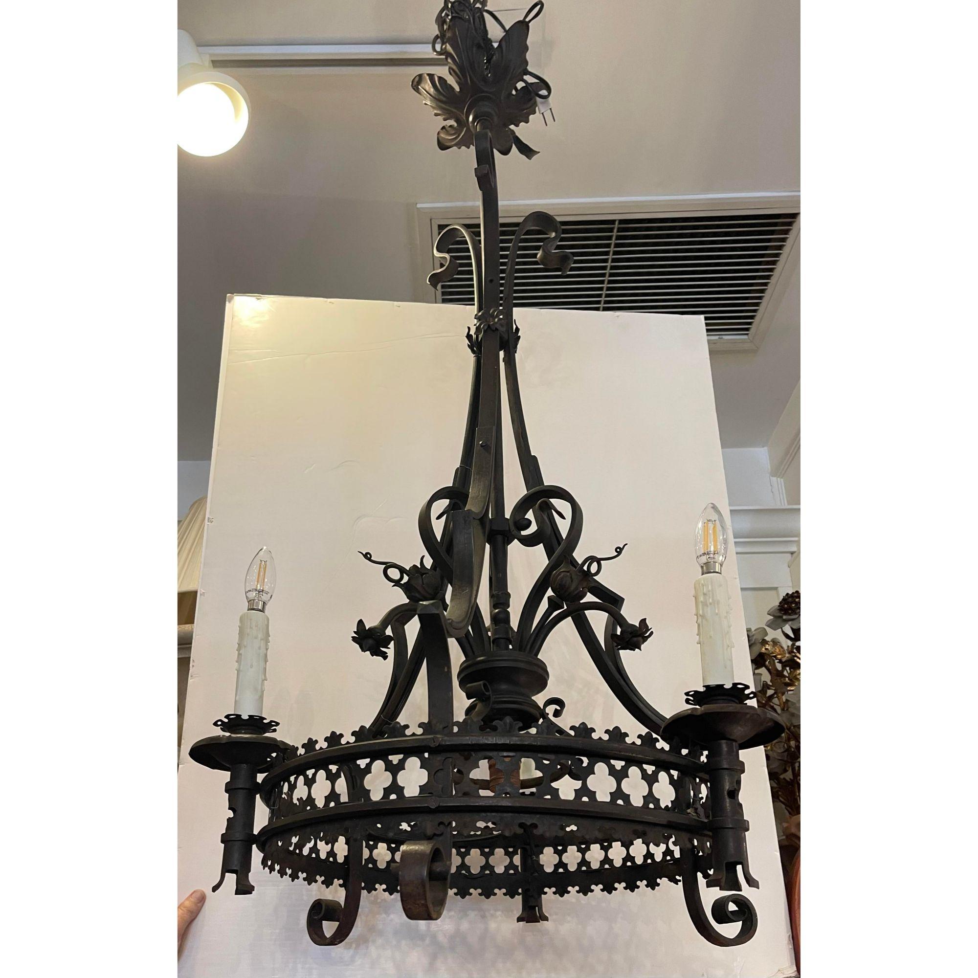 Antique Spanish Colonial wrought iron chandelier

Additional information: 
Materials: lights, wrought iron
Color: black
Period: 1920s
Styles: Spanish Colonial
Power sources: Up to 120V (US Standard) Hardwired
Item Type: Vintage, Antique or