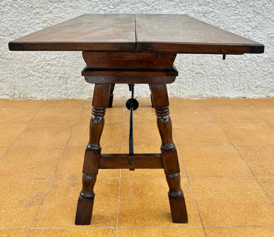 20th Century Antique Spanish Console Fold Out Table with Iron Stretcher and Three Drawers For Sale