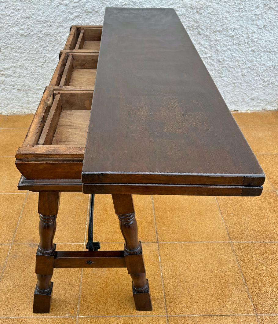 Walnut Antique Spanish Console Fold Out Table with Iron Stretcher and Three Drawers For Sale