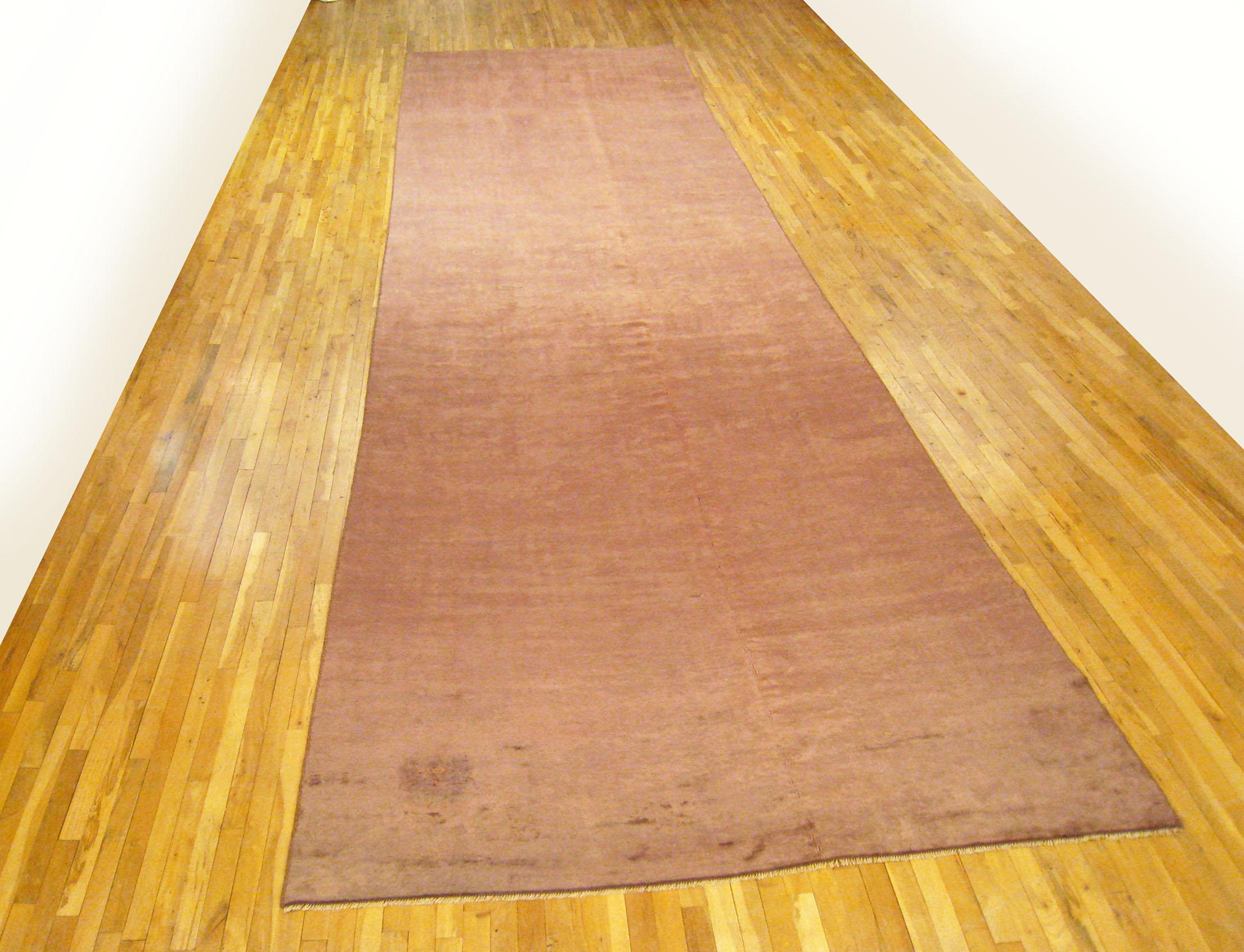Vintage Spanish Savonnerie rug, Gallery size, circa 1920

A one-of-a-kind vintage Spanish Savonnerie oriental carpet, hand-knotted with soft wool pile. Featuring a large mauve open field, in gallery size, size 22' 6