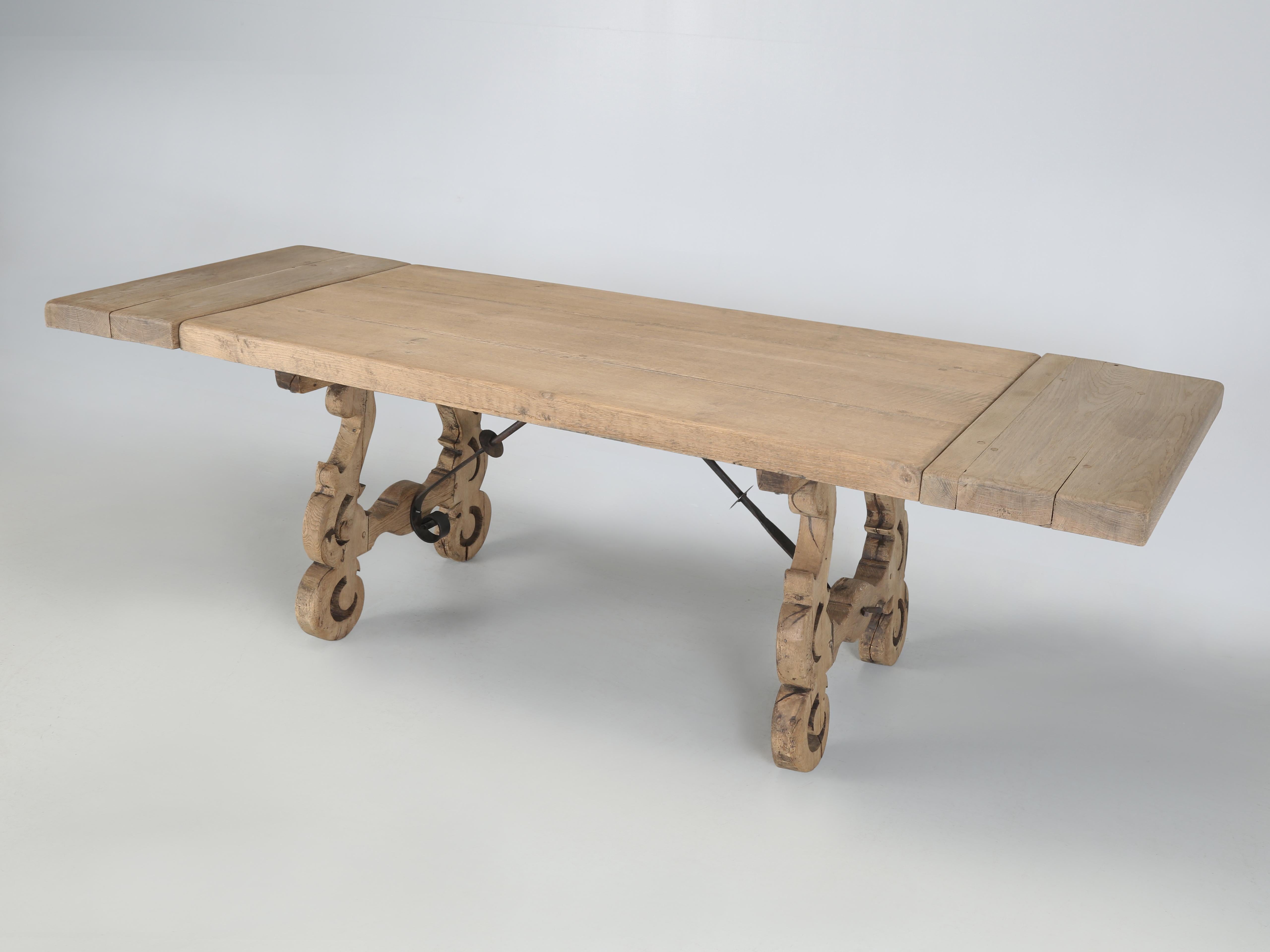 Antique Spanish Dining Room Table with an unusual Pair of Leaves that mount on lopers which pull out of the ends of the table. This Antique Spanish Dining Table was constructed from solid thick White Oak boards and was built to last an eternity.