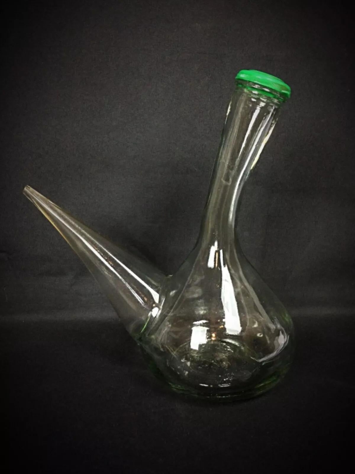 This antique Spanish glass wine decanter combines elegance and functionality. It is in good condition overall, though the interior may require cleaning. Please note that the tip of the spout appears to be either broken or designed that way (see