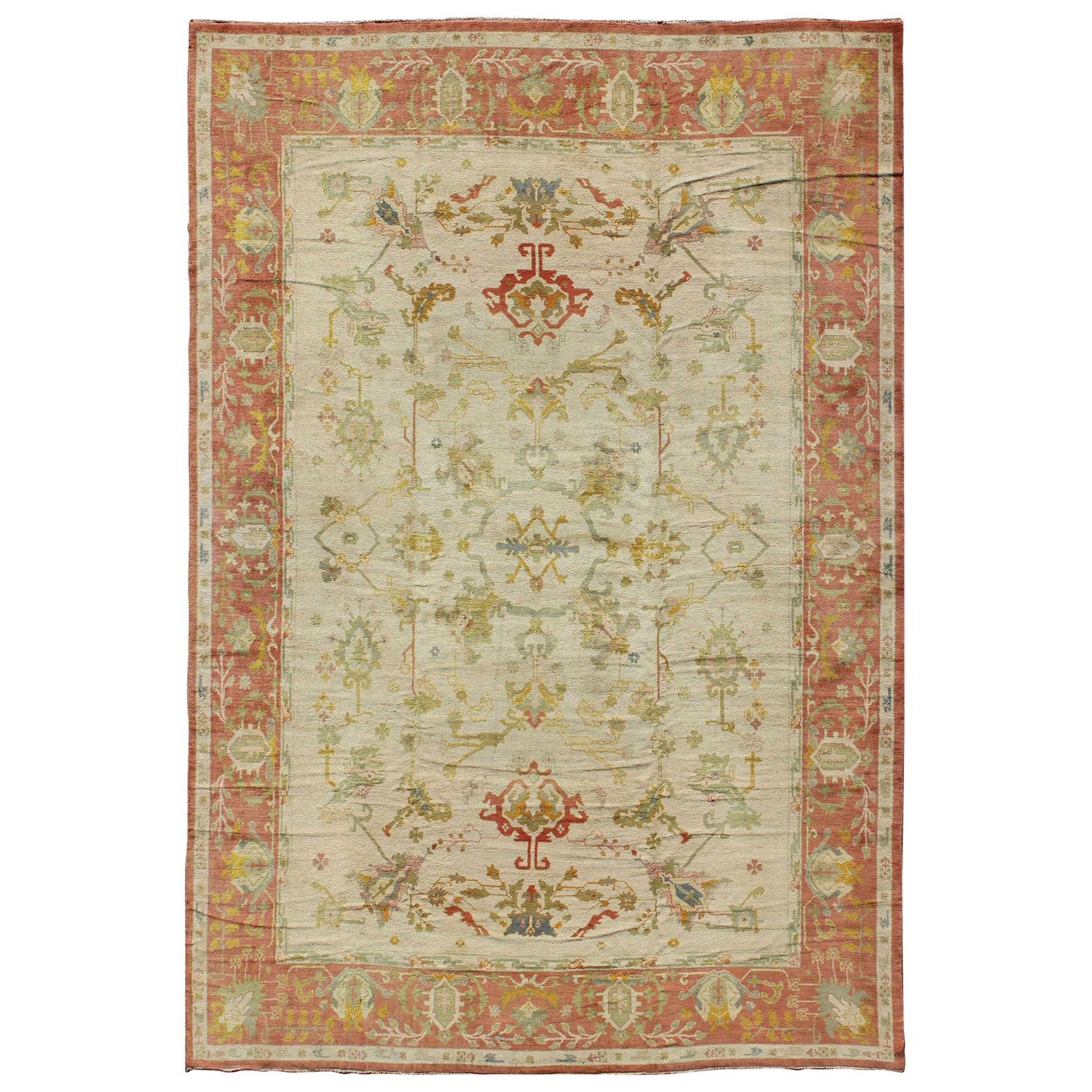 Antique Spanish Large Rug in Ivory Background, Green and Coral Border For Sale