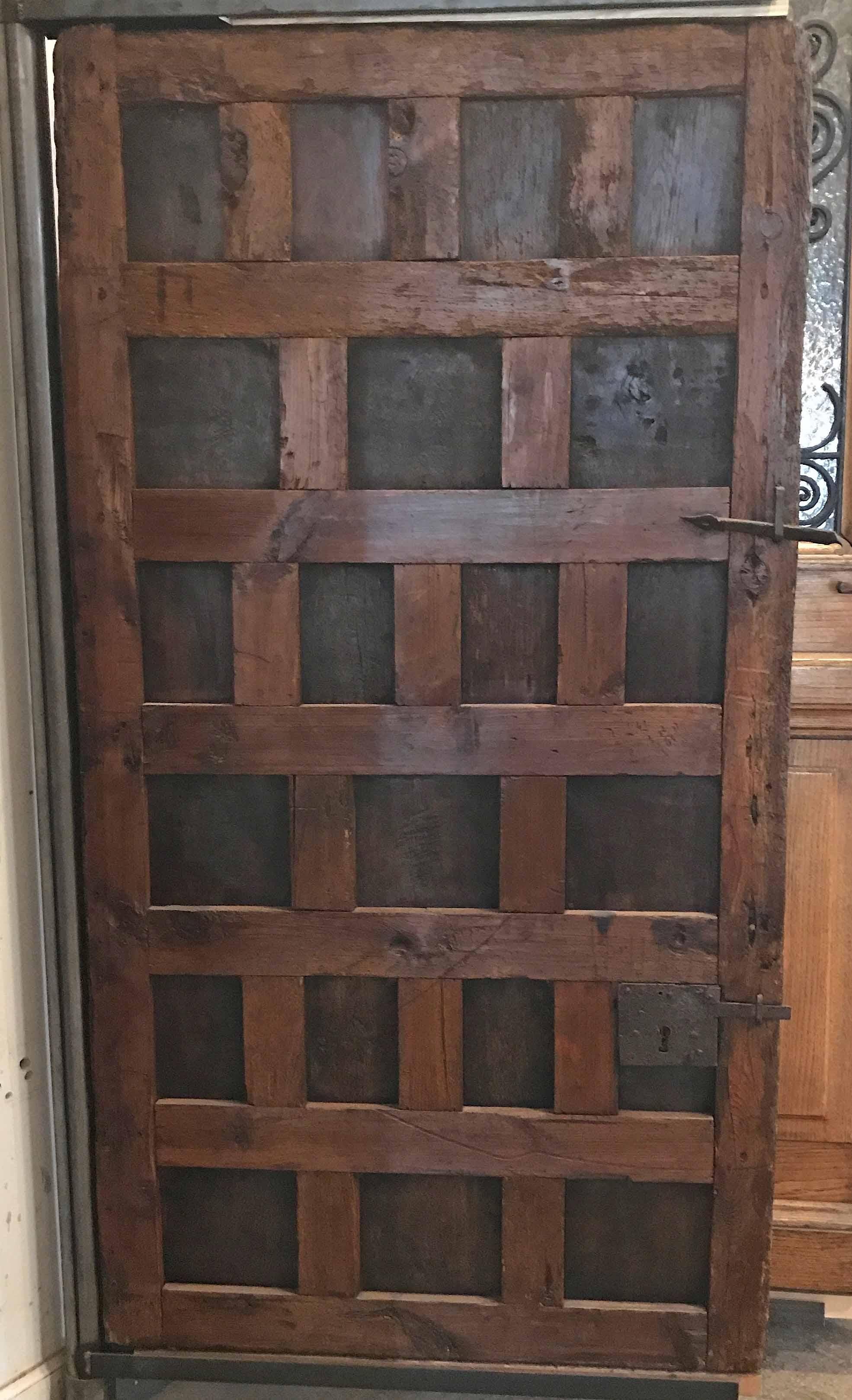 Antique Spanish oak door

Origin: Spain,

circa 1750.

Measurements: 36 1/2