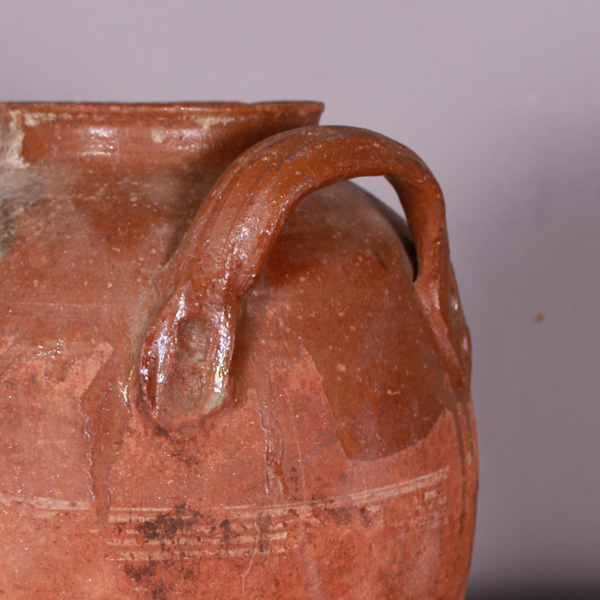 19th C decorative antique Spanish pot with red glaze. 

This is missing a handle as photographed.

Reference: 7479

Dimensions
11 inches (28 cms) High
14 inches (36 cms) Diameter