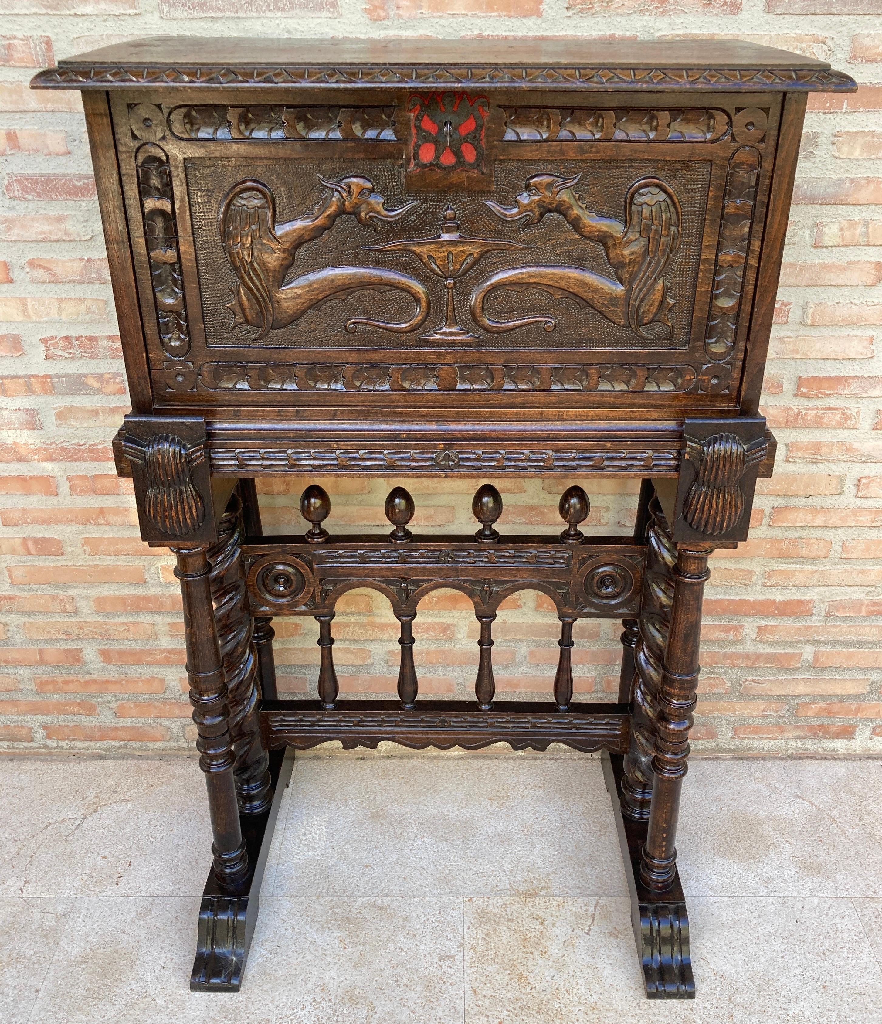 Exquisite late 19th century Renaissance style Spanish Bargueno cabinet, richly carved with wrought iron lock and coil legs.
Incredible details and craftsmanship in a most impressive designer style. The cabinet is full of detail all around and looks