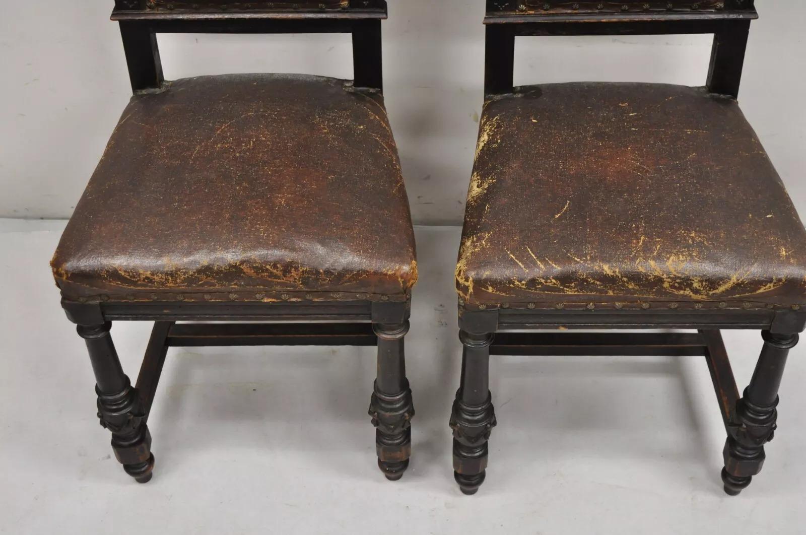 Antique Spanish Renaissance Carved Oak Wood Figural Leather Side Chairs - a Pair In Good Condition For Sale In Philadelphia, PA
