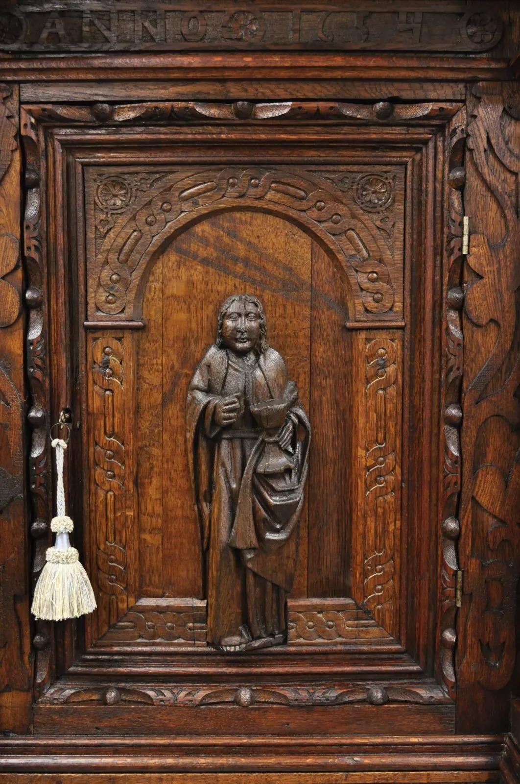 Antique Spanish Renaissance Figural Carved Oak Wood Religious Cupboard Cabinet In Good Condition For Sale In Philadelphia, PA