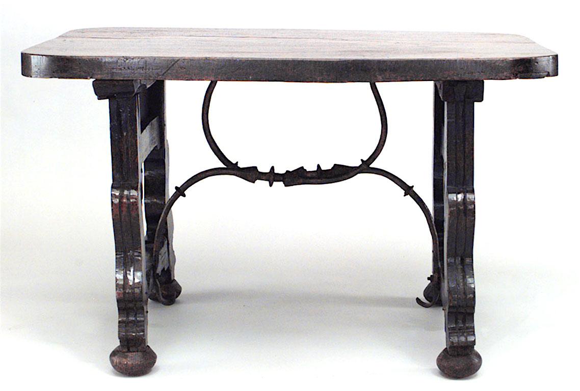 Antique Spanish Renaissance style (18/19th Century) walnut rectangular center table with plank top and double iron stretcher.
