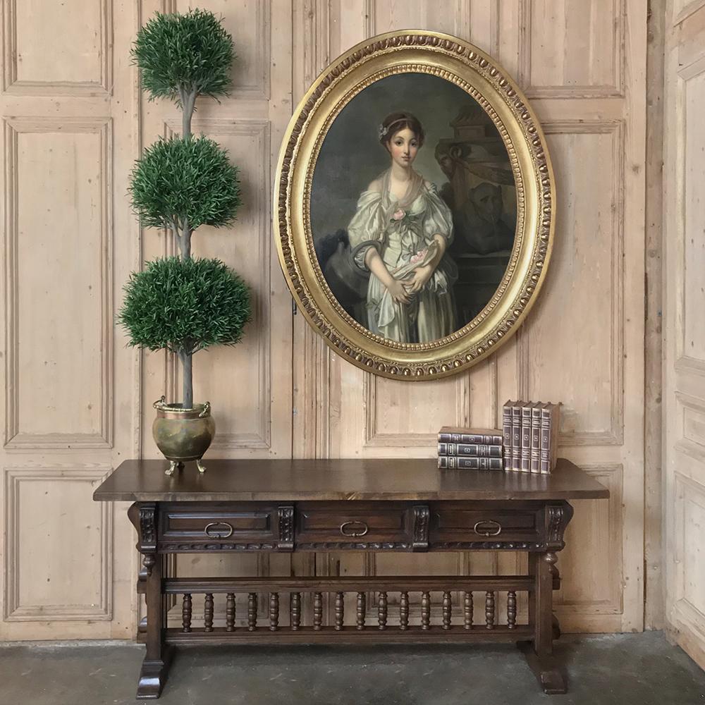 Antique Spanish Renaissance walnut hall table ~ console is also a good choice as a sideboard or sofa table! Handcrafted and carved from solid walnut, it features an intriguing spindle rail trestle, carved corbels, and three convenient drawers below