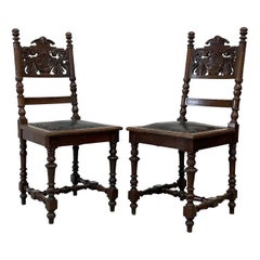 Antique Spanish Revival Carved Oak Side Chairs With Crest Motif & Leather Seats