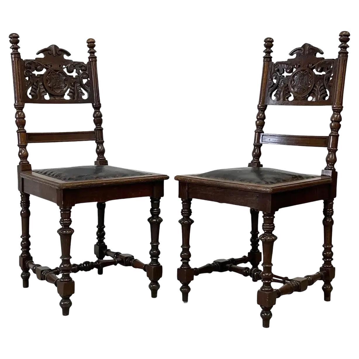 Antique Spanish Revival Carved Oak Side Chairs With Crest Motif
Leather Seats
