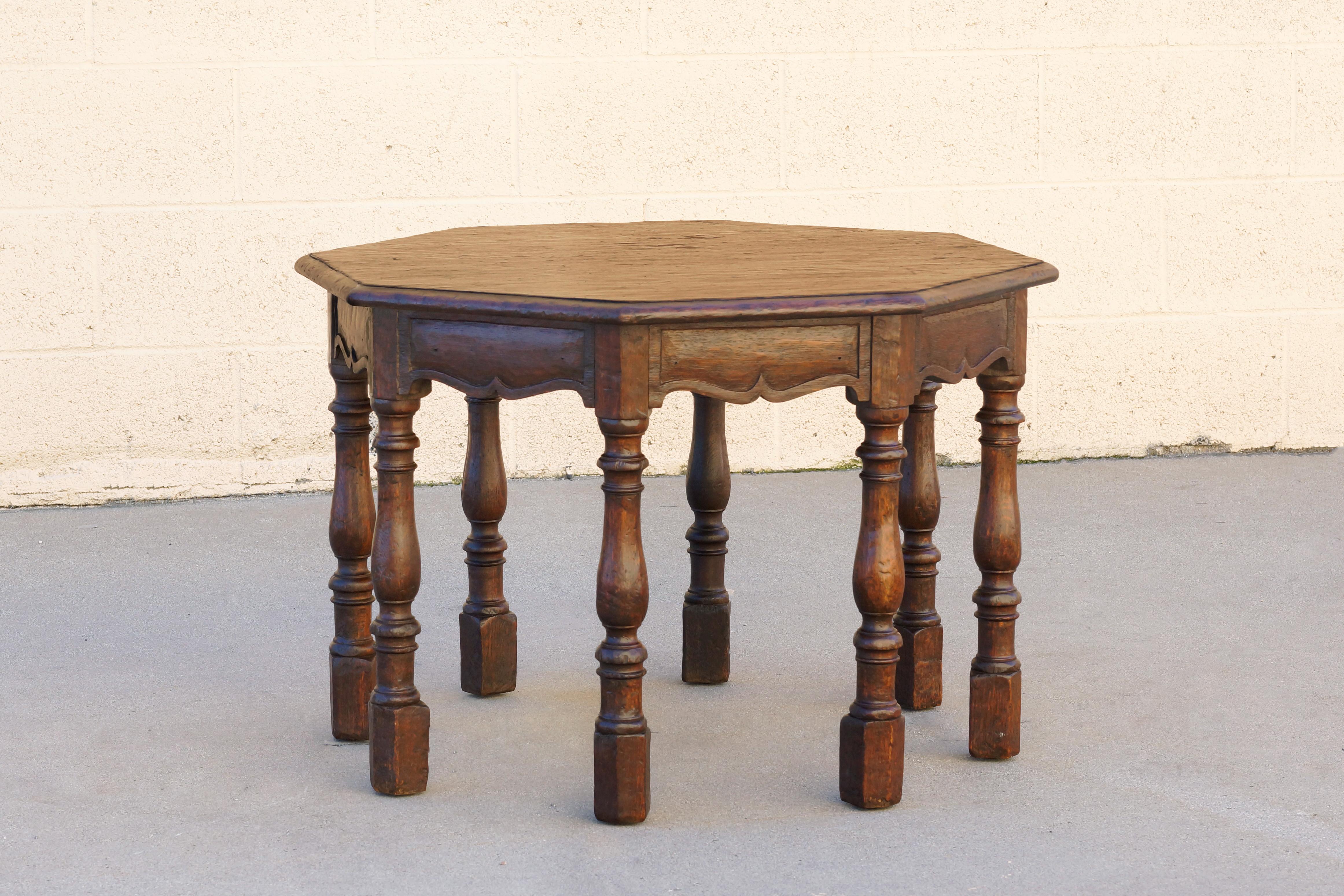Wonderfully unique octagon shaped side table by Marshall Laird, Los Angeles, circa 1920s. Made from hand carved mahogany; Mission/ Spanish Revival style. Marshall Laird was known for the high quality custom furniture he provided to the elite of