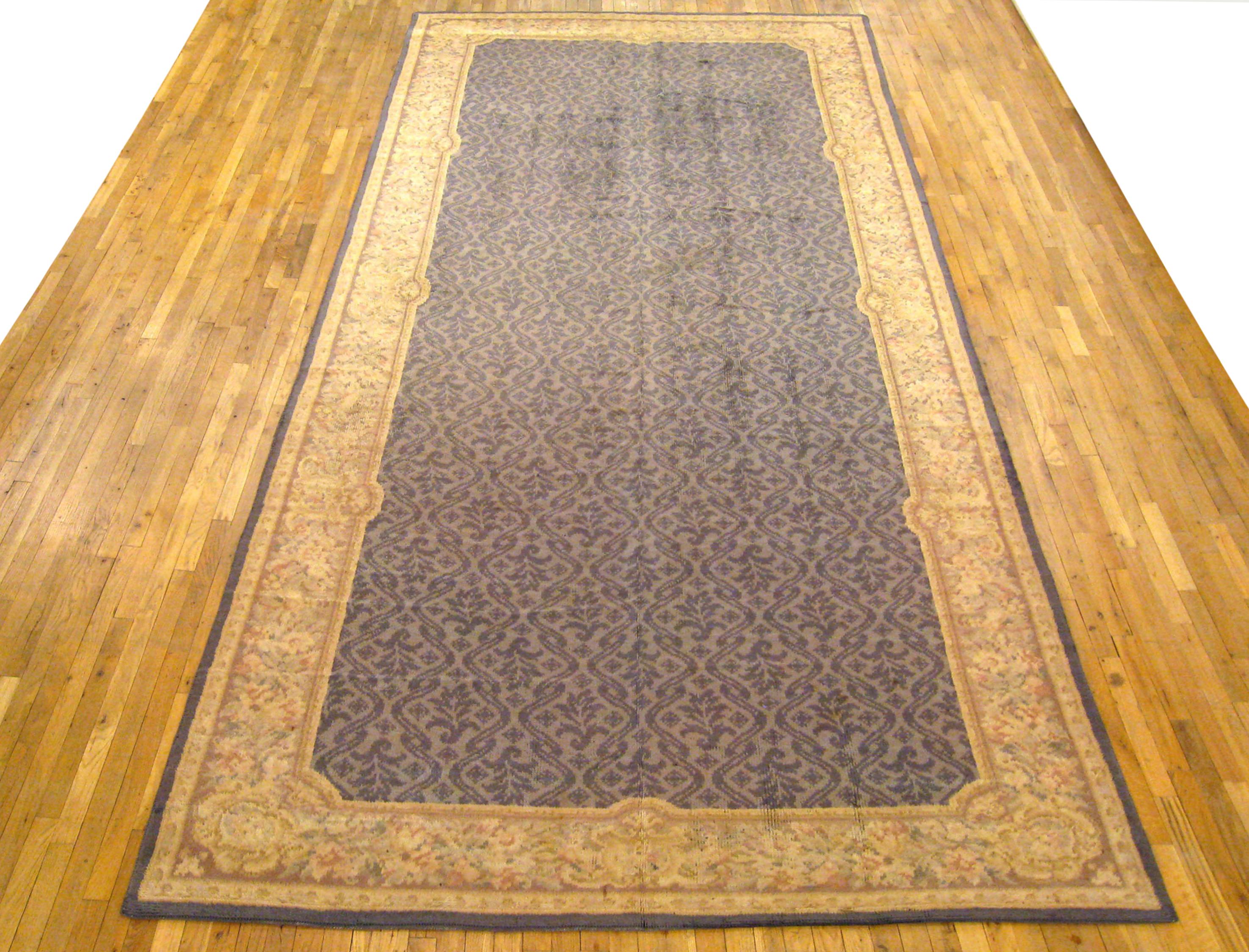 Antique Spanish Savonnerie Rug, Gallery size, circa 1930

A one-of-a-kind antique European Savonnerie Oriental Carpet, hand-knotted with short wool pile. This beautiful rug features a repeating design on the gray primary field, with beige outer
