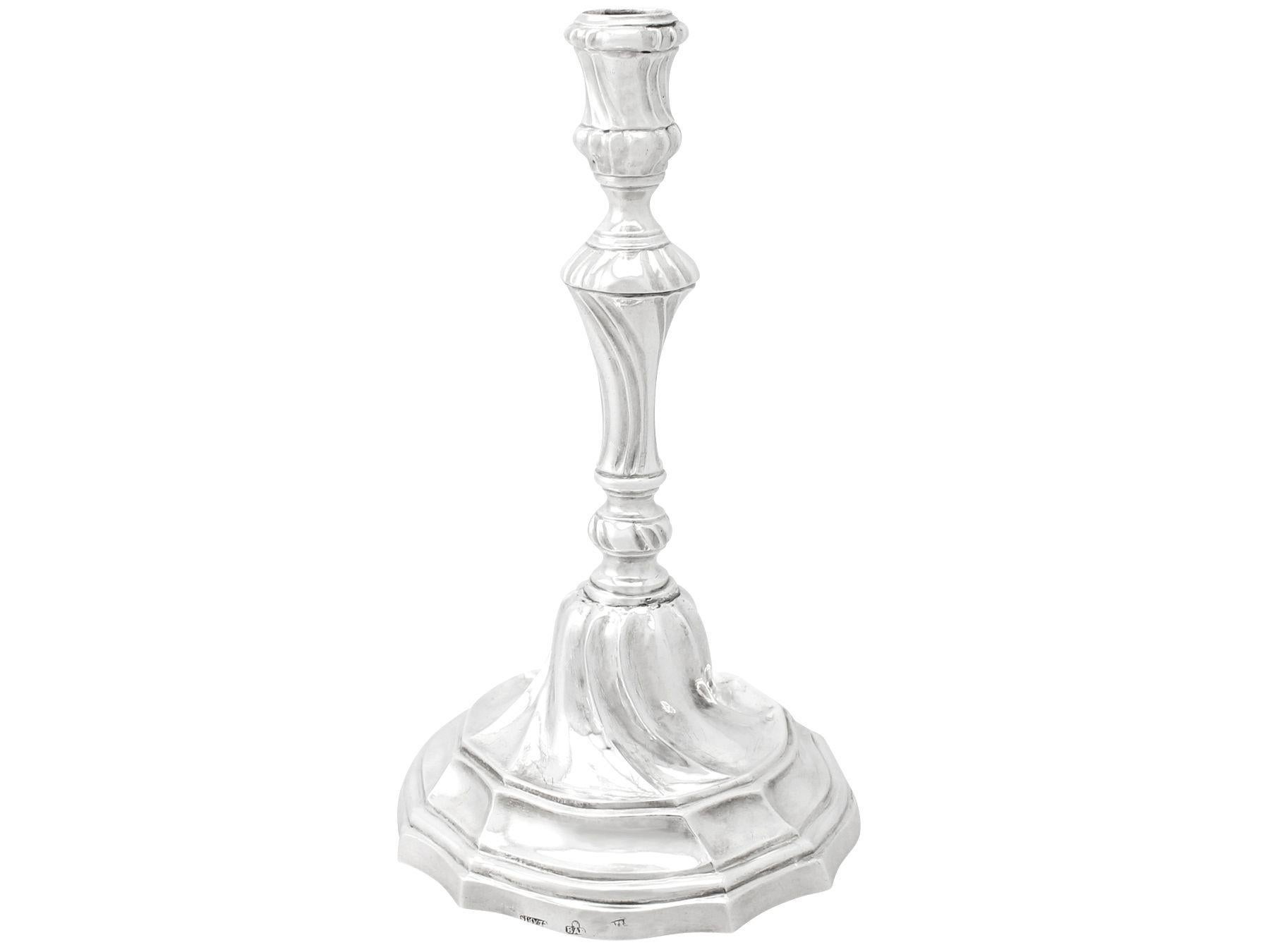 A fine and impressive antique Spanish silver candlestick; an addition of our ornamental silverware collection

This fine antique Spanish silver candlestick has a waisted circular shaped form onto a domed circular shaped base to a colet style