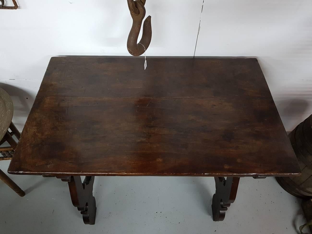 Lovely small size antique Spanish table with a 18th century tabletop and the legs are from the 19th century, because of the size you can put it anywhere.

The measurements are,
Depth 63 cm/ 24.8 inch.
Width 104 cm/ 40.9 inch.
Height 75 cm/ 29.5