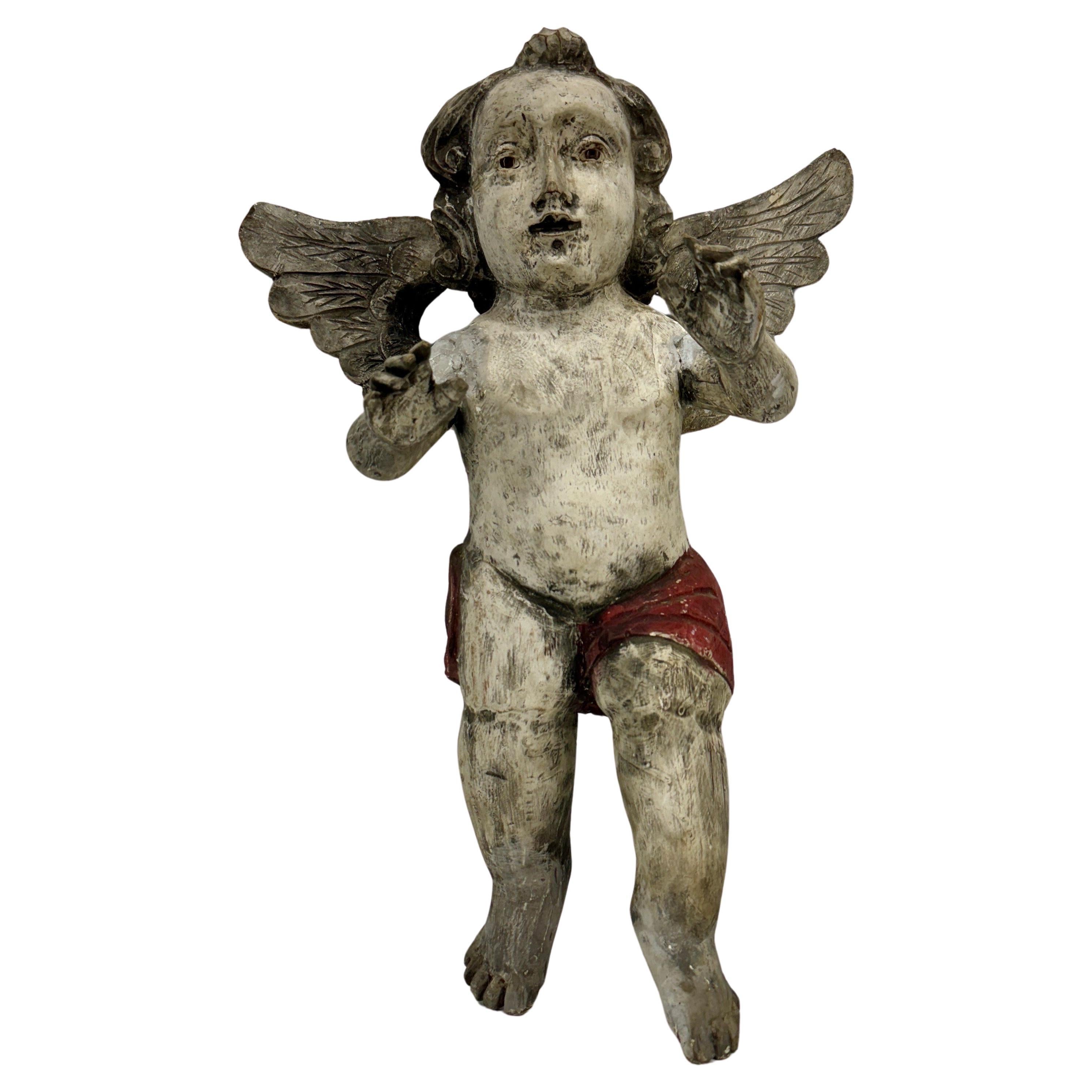 Sculpté à la main Sculpture espagnole ancienne d'ange putti en bois avec ailes en vente
