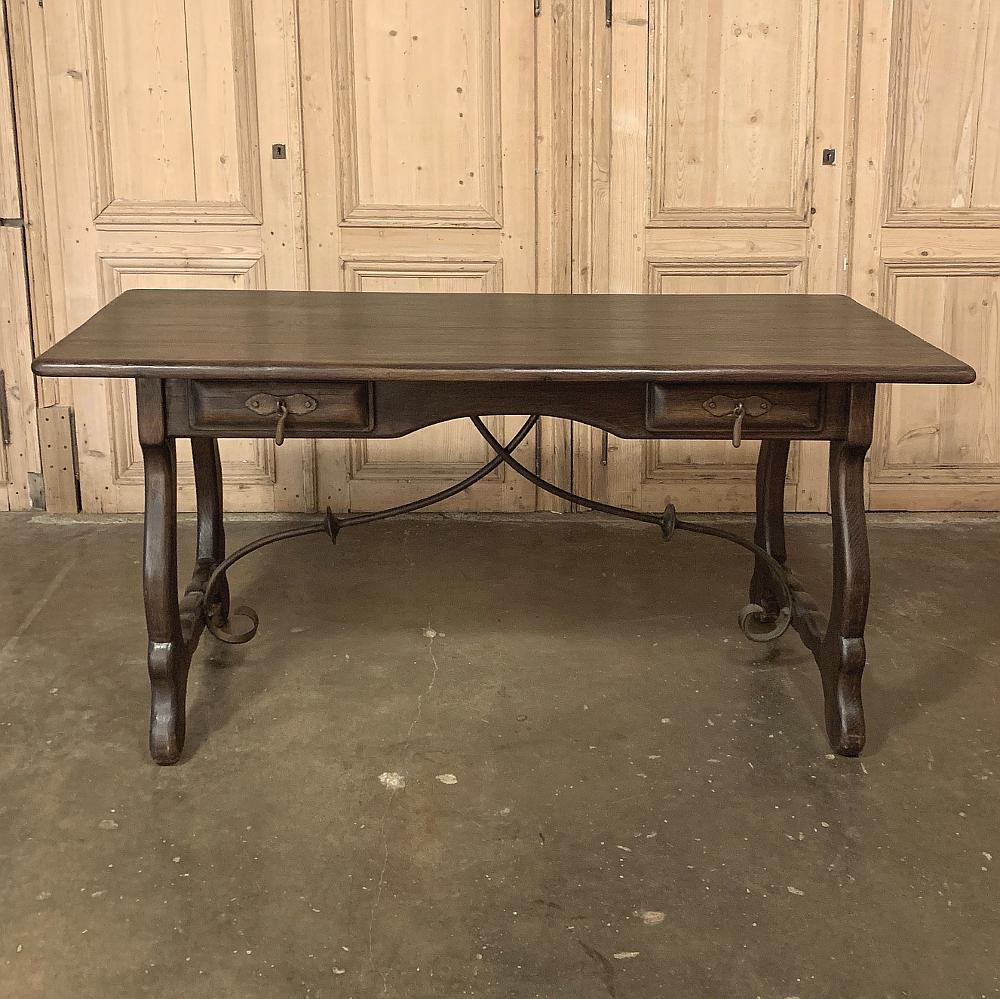 Antique Spanish writing desk is shallow enough to place behind a sofa, or to use as one's primary home office desk, and even as an executive desk at the casual oriented office! Classic lyre-shaped legs with hand forged wrought iron stretchers