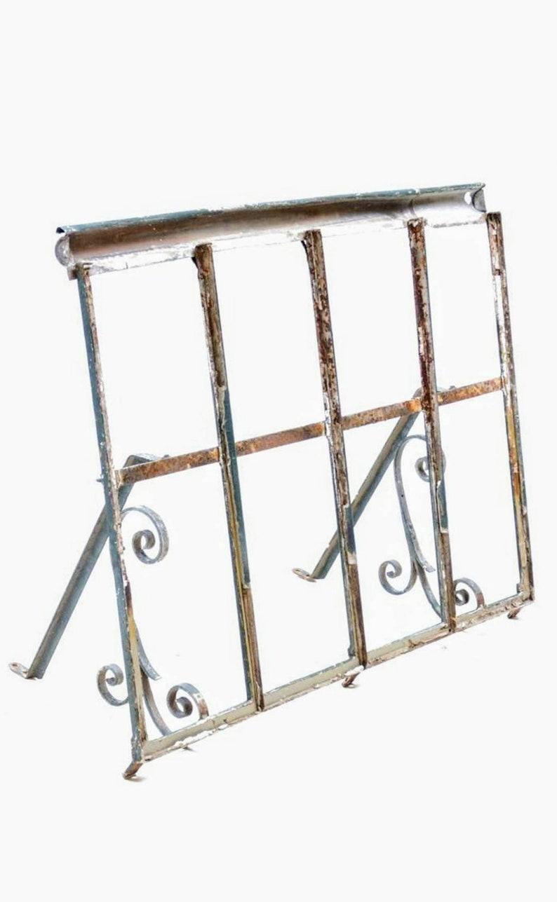 Antique architectural Spanish forged wrought iron awning, scroll motif, beautifully patinated, distressed elegantly aged oxidation. 

Measures: 40