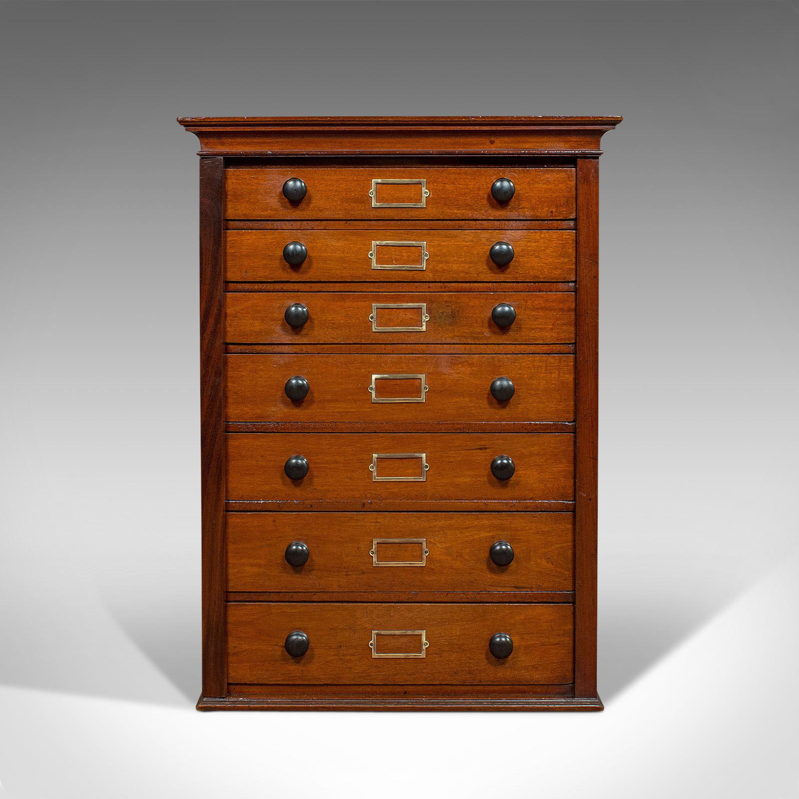 This is an antique specimen cabinet. An English, mahogany and boxwood chest of drawers ideal for shop or retail use, dating to the Edwardian period, circa 1910.

Elegant cabinet from the Edwardian period
Displays a desirable aged patina
Select