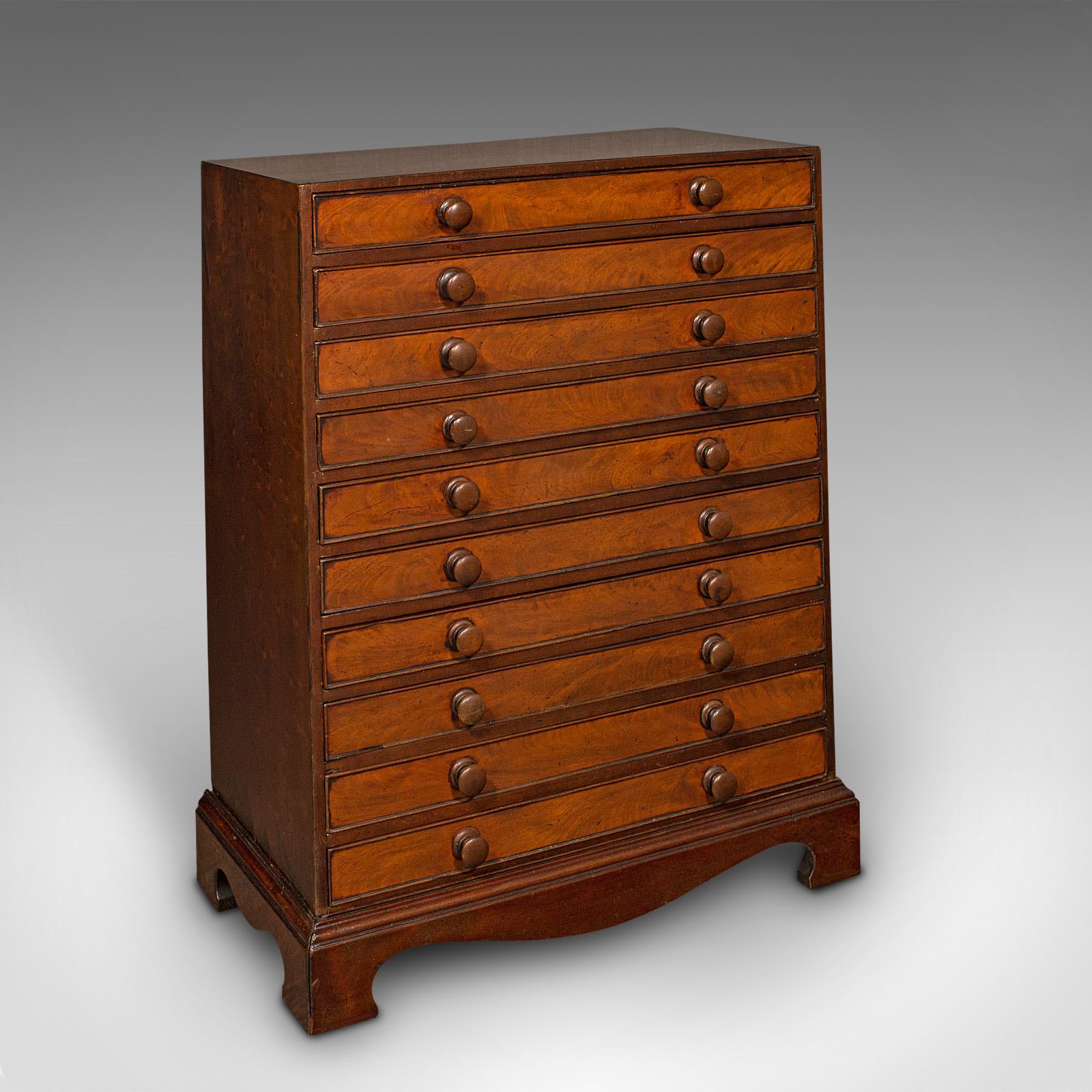This is an antique specimen chest. An English, mahogany suite of collector's drawers, dating to the Georgian period, circa 1800.

Arrangement of ten drawers offers a comprehensive suite for the collector
Displays a desirable aged patina and in good